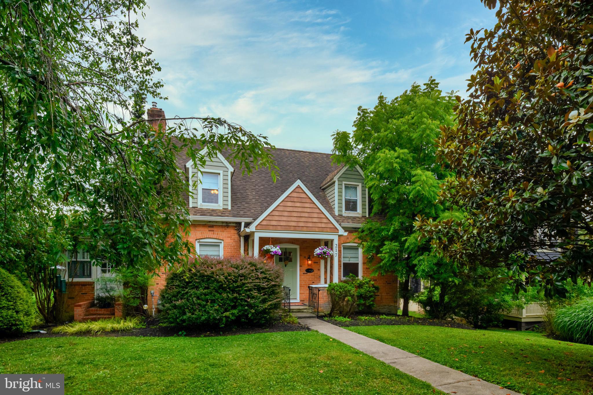 Charming Cape Cod on desirable Church Lane – Pikesville

Nestled on the sought-after Church Lane in Pikesville, this delightful 1940s Cape Cod—once featured in the Baltimore Sun as a “cozy rustic cottage”—beautifully blends timeless character with thoughtful modern updates.

The welcoming main level offers an open-concept living and dining area, ideal for both everyday living and entertaining. The refreshed kitchen features brand-new Whirlpool appliances, while the sunroom—lined with custom built-in bookshelves—creates a bright and versatile space perfect for a reading nook, creative studio, or home office. With its own separate entrance, the sunroom also offers excellent flexibility for professional use.

Upstairs, the home includes a spacious master bedroom with a spa-inspired en-suite, along with a comfortable guest bedroom and bathroom. A finished attic provides additional flexible living space, well-suited for a child’s bedroom, playroom, office, or studio.

The partially finished lower level adds even more potential, featuring thoughtful flagstone flooring throughout, a separate entrance, and a full bath—used as a bedroom, though ideal for an in-law suite, guest quarters, or potential professional or rental opportunity.

Recent improvements include a new roof (2012), brand new siding & modern widened gutters, a new front and two new rear doors, a water heater (3 years ago), and a brand-new central air conditioning unit installed last summer. Hardwood flooring runs throughout the home, and were refinished approximately 10 years ago, and neutral beige blinds throughout were installed four years ago. The living room is anchored by a striking black granite/marble pellet stove fireplace, adding warmth and elegance to this cosy space.

Additional features include a garage with shelving for ample storage and mature landscaping with cherry and magnolia trees. The beautifully maintained yard offers an inviting space for outdoor entertaining. The property is professionally maintained with biannual pest control and duct cleaning every 3-years.

At the rear of the home, just off the mudroom, is a well-maintained split-level deck designed for easy, low-maintenance living. Constructed of durable, no-maintenance materials, it requires no staining—just an occasional power wash to keep it looking its best.

The multi-level layout provides excellent space for both relaxing and entertaining, with distinct areas for dining and lounging. The lower level deck is a perfect space for a future hot tub, should the next owner wish to add one, creating an ideal private retreat right in the backyard.

Optional inclusions may be available, including a treadmill, Peloton bike, snow blower, ride-on lawn mower, power washer, leaf blower and selected furniture items 

Location Highlights:

* Less than one mile to I-695 for easy commuting 
* Minutes to Wegmans, Trader Joe’s, Whole Foods, and The Foundry shopping complex
* Situated in a quiet matured neighborhood 
* Active neighborhood association and neighborhood watch
* Nearby community park and playground the product of a hardworking neighborhood association 

This is a rare opportunity to own a thoughtfully maintained, highly functional home in one of Pikesville’s most established and desirable neighborhoods.