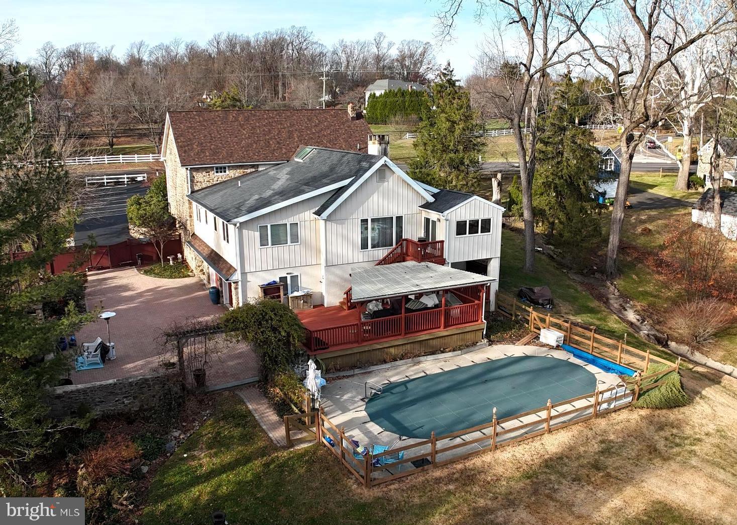 Discover a truly rare find in Bucks County. This expansive 4,900 sq. ft. residential masterpiece is far from traditional, offering a unique architectural canvas that invites you to dream, design, and create. Whether you envision a sprawling gallery-style great room, a state-of-the-art in-home theater, or a professional studio, this residence provides the scale and versatility to make it a reality.
The heart of the home is designed for both connection and comfort. A central living room serves as a generous gathering hub, anchored by a seamless flow into the adjacent kitchen and dining area, overlooking the 1.3 acres, bringing the beauty of the outdoors inside.
The potential continues downstairs. The finished lower-level living space adds a third bedroom—which could easily serve as a secluded home office or game room—complete with a welcoming foyer. Beyond the finished rooms lies a vast area for expansion: perfect for a home gym, a secondary entertainment lounge, or hobbyist workshops.
Host summer gatherings by the heated in-ground pool or spend crisp autumn evenings at the charming courtyard firepit, perfect for s'mores under the stars.
An attached 2-car garage includes extra storage for pool and outdoor gear, supplemented by a detached shed for all your gardening and landscaping needs.
An automatic security gate provides peace of mind, creating a sophisticated transition from the street frontage to the total tranquility of the rear grounds.
Located in the prestigious Central Bucks School District, this property offers the perfect balance of seclusion and accessibility.
This unique residential space is a "must-see" to fully appreciate its scale and potential.