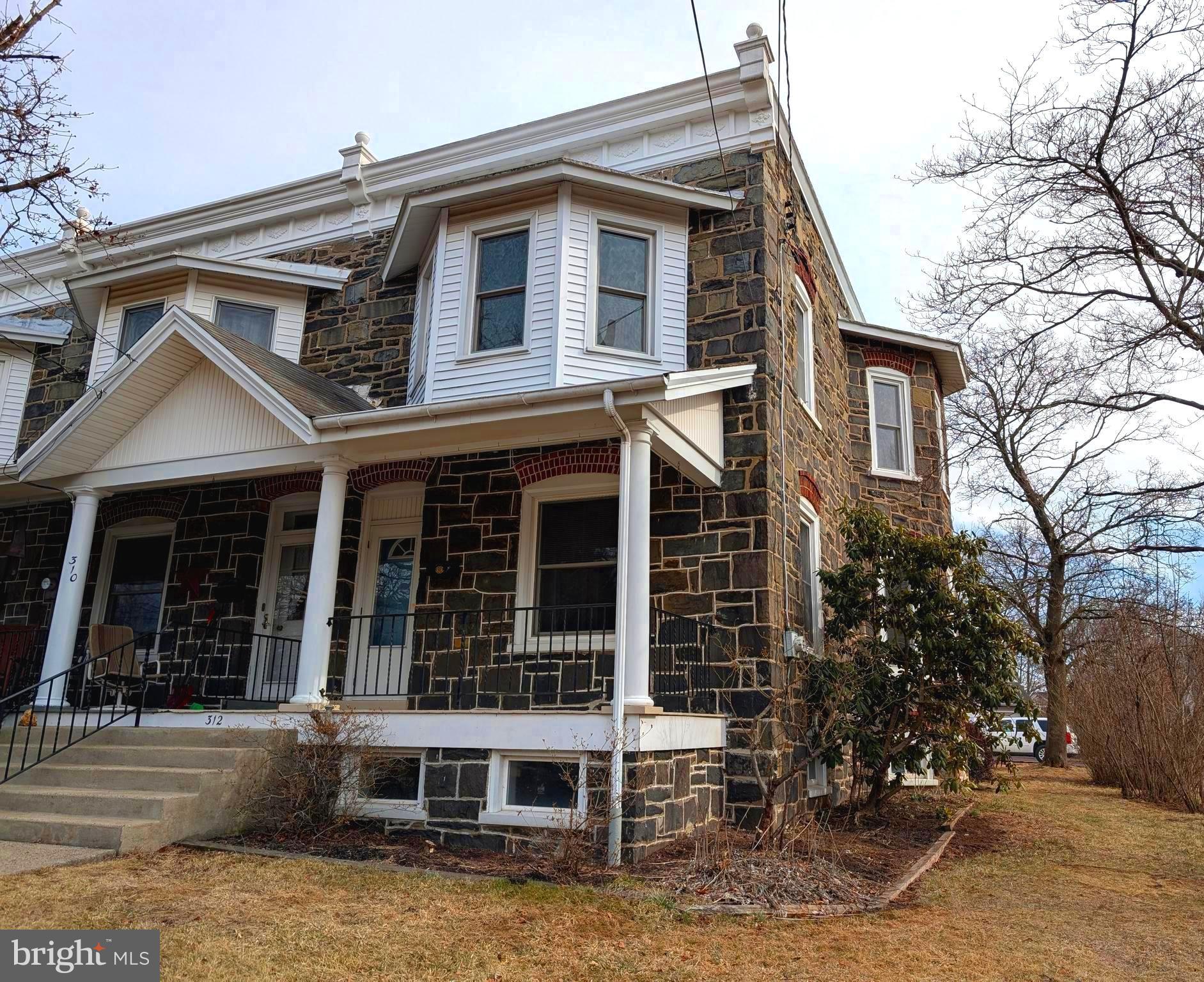 Welcome to 312 Erie Ave.  This is a spacious Stone end unit home located in a quiet neighborhood in Telford Borough.  Enter the home from a large Inviting Covered Front Porch.  This would be a great spaces to enjoy the warmer evenings that await us in the coming weeks.  Enter into the living room painted with neutral colors, abundant windows and natural sunlight fills the room.  All the windows in this home have extra deep window sills.  This room has the original hadwood floors naturally distressed over time.  A bright spacious dining rooms follows with built-in cabinetry and chair railings.  The kitchen is small but quaint with newer oak cabinets.  Off the kitchen you can go to your private back covered patio, very inviting space to enjoy your morning coffee.  This also leads you to the spacious  back and side yard , also the one car garage. Lots of space for picnics and entertaining here.  Back inside the staircase to upstairs takes you to three comfortable bedrooms and a full bathroom all with large windows and lots of natural light.  Need extra space the basement has a laundry area and the potential of finished area with a rear exit leading to the back yard and this too has plenty of windows allowing natural light inside.  Location is great! Access to shopping, commuter rails, downtown Telford and Souderton area shopping , dining and entertainment.  A home like this is truely hard to find at this price!  Make the time to schedule your showing today!