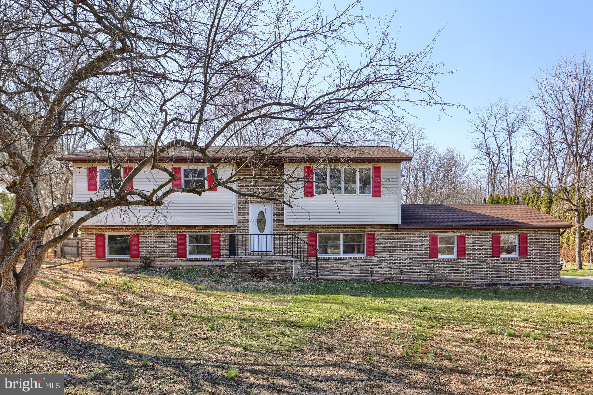 Updated Bi-Level in the country, sitting on just over 1.5 acres.  Rural setting but still close to all amenities.  Open floor plan and plenty of space.  Updates include TWO new kitchens, cabinets, & stainless steel appliances.  Refinished hardwood floors & new laminate flooring.  All new doors, interior and exterior.  Several new window replacements.  Lower level has been completely remodeled to include a secondary kitchen, spacious family room with tile flooring & wood stove, a 4th bedroom, new full bathroom, and spacious bonus room which could be an office or oversized mud room.  New HVAC, water heater, water softener, & septic tank.  Large rear deck has been rebuilt and is great for overlooking the back yard.  All this work and freshly painted through makes this home move in ready.  Call today for a tour!