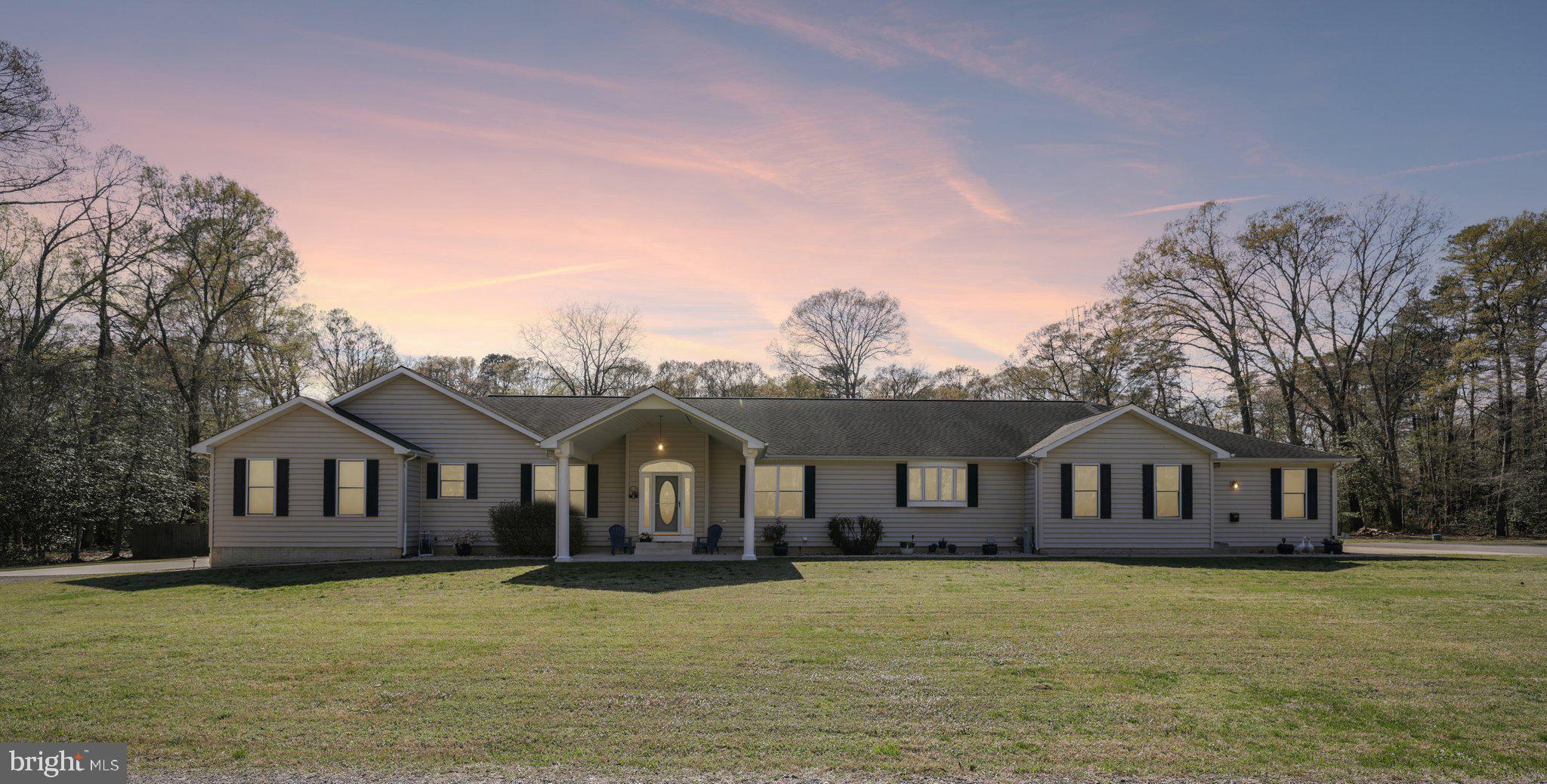 Welcome home to 54 Dayton Drive, ideally situated in the heart of Pasadena, MD. Set on an expansive 3.81-acre lot, this impressive 8-bedroom, 4 full and 2 half-bath residence offers space, flexibility, and exceptional lifestyle opportunities—get ready to be truly wowed. The main level of this two-story rancher features four spacious bedrooms and four bathrooms. One of the bedrooms is currently utilized as a private business or hobby space and includes its own separate entrance—perfect for a home office or studio. Designed with both comfort and entertaining in mind, the home showcases an open-concept layout complemented by multiple living areas that can easily serve as a formal living room, theater or media room, game room, or additional entertaining space. Generously sized bedrooms and abundant closet space reflect the thoughtful design and craftsmanship that went into every detail of this home. The kitchen and bathrooms on the main level are beautifully appointed, showcasing quality finishes throughout. The primary suite is a true retreat, complete with a spacious layout and a luxurious Jacuzzi-style tub—perfect for unwinding at the end of the day. The fully finished lower level offers incredible versatility, featuring four additional bedrooms and two full bathrooms. This level is thoughtfully divided into two separate, private living spaces—ideal for multigenerational living or income-producing potential. Currently, one unit generates $1,800 per month, with one long-term tenant already in place under a lease through October 1st, which will transfer to the new owner. As you approach the property, you’ll appreciate the multiple driveways providing convenient access to various points of the home and grounds. The main residence includes a two-car garage with ample storage, along with additional storage sheds and a pool house shed that convey with the property. With nearly four acres of land, there is plenty of room for recreational vehicles, hobbies, or even a home-based business—all with the benefit of privacy and space. Outdoor living is just as impressive. Enjoy your own backyard oasis featuring an in-ground pool with a liner replaced just three years ago, as well as a hot tub—perfectly positioned for year-round enjoyment and entertaining. With endless possibilities, including the potential to build an additional dwelling (subject to buyer’s due diligence and approvals), this one-of-a-kind property offers a rare combination of luxury, income potential, and flexibility. Schedule your private tour today and experience all that this remarkable home has to offer.