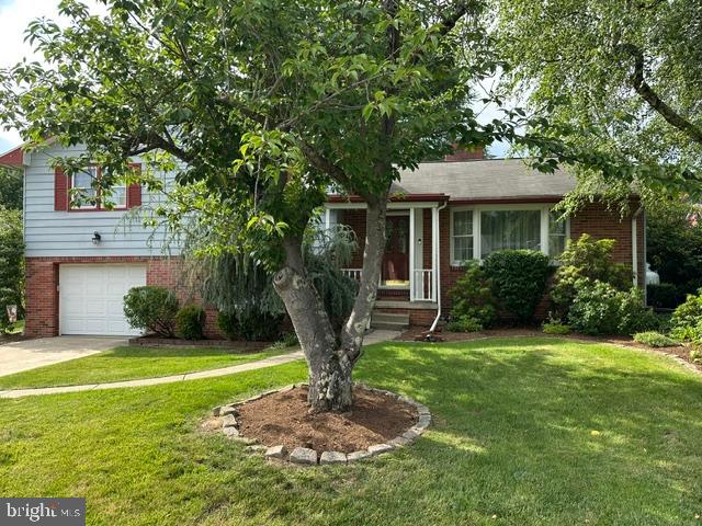 Beautifully landscaped and very well-maintained split level with hardwood flooring, living room with propane fireplace, rear enclosed sunroom, attached garage, central air, built in bookcases, replacement windows, half bath, attached bath to main bedroom, rec room, 4 bedrooms, laundry room.  Bedrooms with carpet have hardwood under the carpet.  Recently replaced electric box by certified electrician and newly installed human door from garage to laundry room.  Also, the basement walls were cleaned and painted by professionals and old insulation in the attic replaced with treated and new insulation.  This home has been especially cared for and preventive maintenance done.  Make 328 Cottage Place your home in a desirable neighborhood that is conveniently located and close to healthcare facilities, schools and stores.