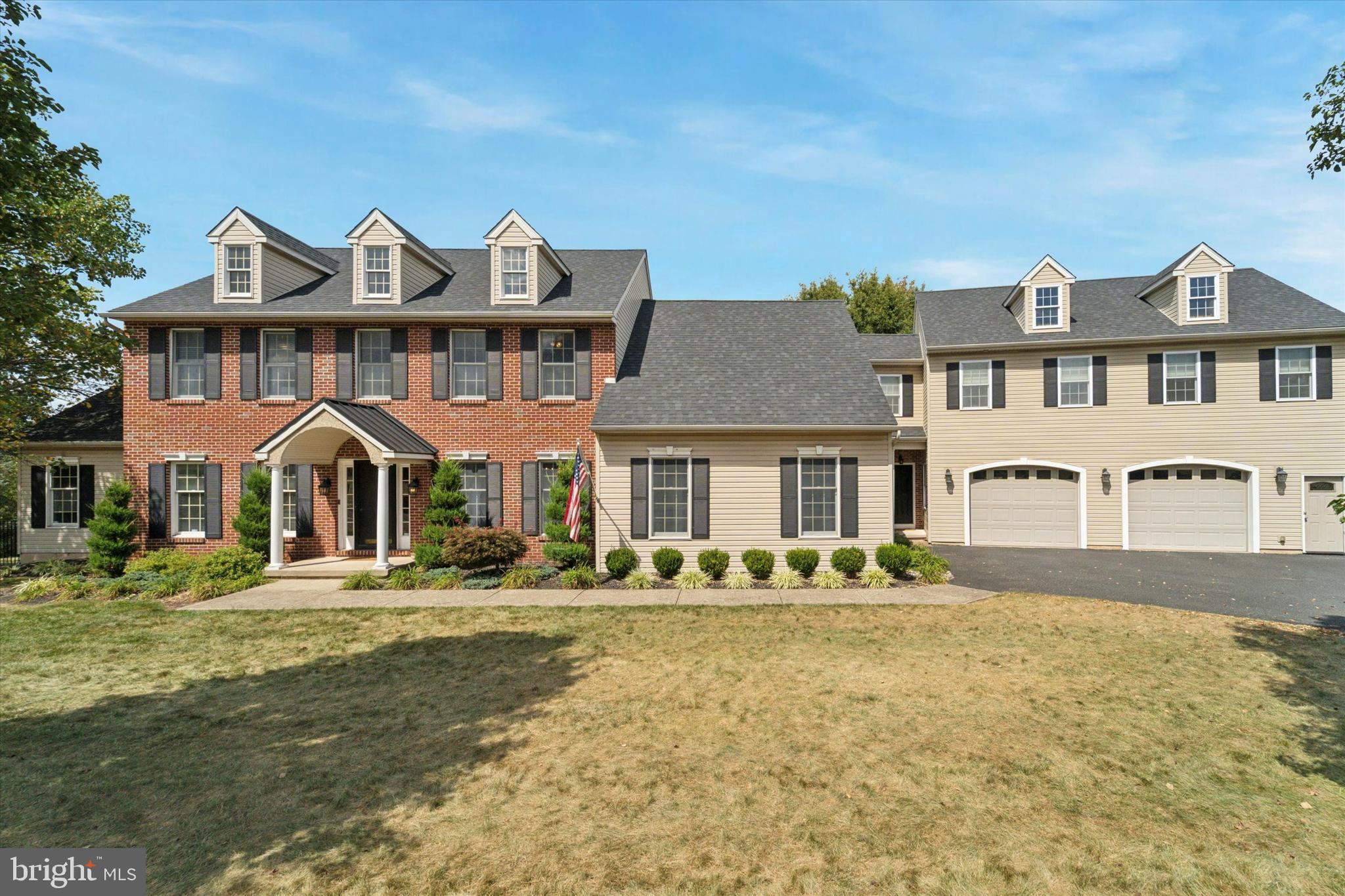 Welcome to the impressive Spring-ford Area School District home, perfectly designed for both grand entertaining and comfortable family living, complete with an in-law or guest suite.  This gorgeous home boasts a striking brick and siding facade, complemented by classic black shutters and a welcoming covered front entry.  The mature landscaping enhances its curb appeal, while an expansive driveway leads to a convenient two-car oversized garage, providing ample parking and storage.
Step inside to a bright and elegant two-story foyer where rich hardwood floors flow throughout the main living areas. A dedicated home office awaits behind beautiful French doors, offering abundant natural light and plenty of space for productivity. The formal dining room, complete with a new chandelier, fresh paint, chair rail molding and large windows is perfect for hosting dinner parties. The heart of the home is an open family room, featuring a cozy fireplace and ceiling fan,  seamlessly connecting to the kitchen for effortless entertaining. Thru the barn door you'll find a versatile bonus room with a vaulted ceiling and plush carpeting which offers endless possibilities as a play area, secondary living room,  gym, or second office, highlighted by a feature wall with cabinets and an arched window.
The main kitchen features elegant wooden cabinetry, granite countertops, a tile backsplash, and stainless steel appliances, including a french-door refrigerator and a central island with pendant lighting and seating. Adjacent to the kitchen, a charming breakfast nook with a decorative chandelier opens to a large deck through French doors, offering serene views of the pool & yard. Down the hall from the kitchen you'll find another spacious family room with large windows and natural light followed by the large mudroom area leading to the second entryway & garage.
The primary bedroom is a serene retreat with vaulted ceilings, a ceiling fan, and plush carpeting. The en-suite bathroom features a luxurious soaking tub, dual vanity with ample counter space. This bedroom also offers a bonus area. Add'l 3 upper level bedrooms share a newly renovated hall bath w/ contemporary dual vanity with dark wood, sleek black fixtures, and a glass-enclosed tile shower.  
The finished lower level provides even more living space, including a gathering room with vinyl plank flooring. This level also features a convenient kitchenette with blue cabinetry, a refrigerator, and shiplap accents, ideal for entertaining. French doors lead to the expansive outdoor living area. A flexible bonus room, currently used for storage/guest room, and a modern powder room complete this level.
Above the garage you'll find an in-law suite (with separate entrance) complete with a beautifully designed eat-in kitchen with crisp white cabinetry, dark countertops, and stainless steel appliances. This space has a large living area, bedroom, full bath, walk in closet, and its own laundry area (with a door that connects to the primary bedroom retreat of the main house. )
Next, step outside to your private oasis! The expansive backyard features a sparkling inground pool and hot tub, all surrounded by a large patio with plenty of space for loungers and dining. A covered patio area beneath the deck provides a shaded retreat. The deck, accessible from the kitchen, offers additional seating areas perfect for enjoying the views and outdoor entertaining.
Don't miss this opportunity! Close to Route 422, shopping and dining.
