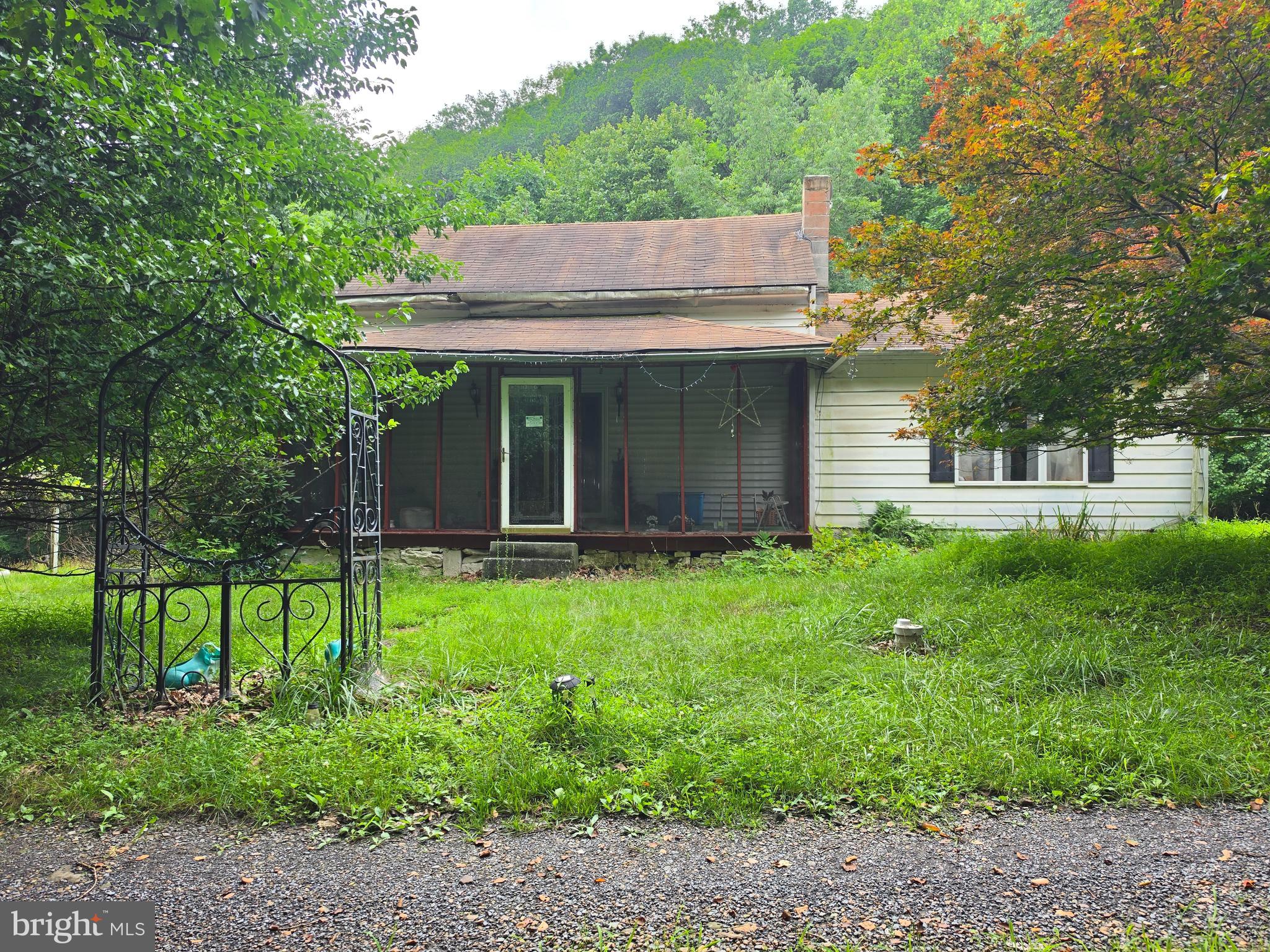 Unlimited Potential on 13+ Scenic Acres!
If you're looking for off-the-chart potential in a peaceful rural setting, this 13+ acre property is full of opportunity. Conveniently located for easy travel throughout the tri-state area, it offers the perfect balance of country privacy and accessibility.  All part of Mountain Side Maryland.  Whether you're searching for your next investment project, a future Airbnb, a hunting retreat, or a relaxing weekend getaway, this property offers endless possibilities. The 3-bedroom, 2-bath cottage features a functional floor plan ready for your vision and updates. The basement provides excellent storage space, including an additional room that's ideal for tools, equipment, or seasonal items.  Outside, you'll find plenty of room to enjoy the outdoors, garden, explore, or simply take in the peaceful surroundings. Located approximately two hours from Baltimore, Washington, D.C., and Pittsburgh, this property is an attractive option for those seeking an affordable escape from city life.  Important Information: This property is being sold strictly "As Is." Due to the property's condition, the access road (AWD recommended) and the absence of a conventional septic system, cash buyers only are strongly recommended. Proof of funds is required prior to scheduling a showing. All showings are conducted at the buyer's own risk. The well was installed approximately 16 years ago.  Bring your imagination and unlock the incredible potential this unique country property has to offer!