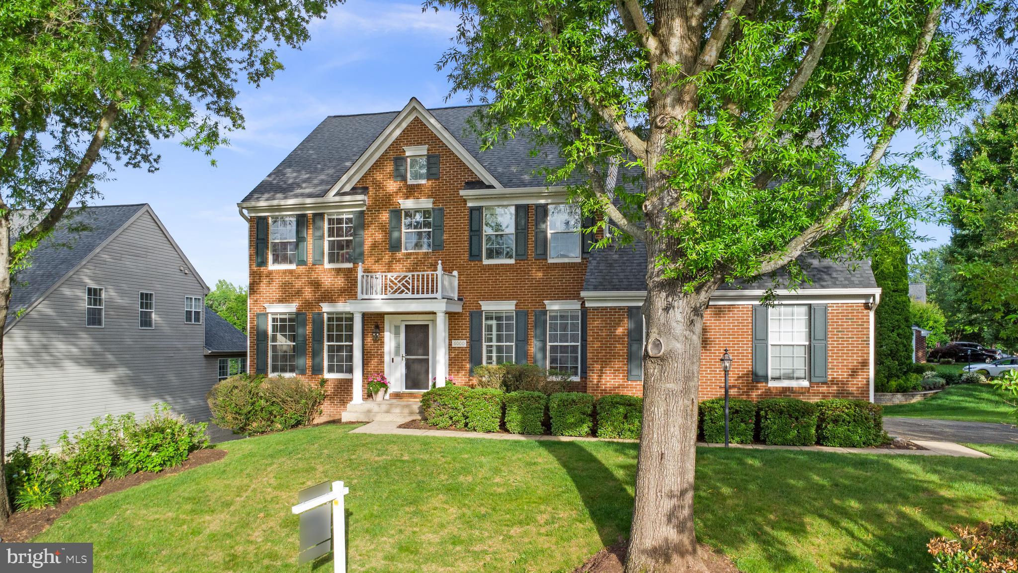 Now Presenting this Nearly 4,500 Sq. Ft. Stately  Brick-front Colonial Home With Portico Roof Over Main Entry 4 BR / 3 BA / 1 1/2 BA Home With Walk-Out Basement and Side Loading 2-Car Garage on Elevated Over 1/4 Acre Corner Lot in the Popular Ashland Reserve Community in Manassas near Montclair. Upon entry to home, you are greeted by two level vaulted foyer, grand staircase with oak hardwood flooring and white railings leading upstairs, oak hardwood flooring throughout most of the main level and traditional floor plan. To the left of the front door is sitting room / reading room with extended crown molding and formal dining room with wainscoting and extended crown molding. To the right of the front door is coat closet, main level powder room and newly painted main level office with French Doors. Navigating through the home, you reach huge open floor plan kitchen with continued hardwoods and great room combination with carpet that both are equipped with extra sunny windows, have views of the gas log fireplace, stylish ceiling fan and have adjacent main level exit to the back yard that includes beautifully maintained and oversized deck with two sided privacy pergola, making it ideal for exterior entertaining. In the kitchen, you are greeted with Recessed Lighting, 42 Inch Oak Cabinets, Kitchen Island, White Appliances, Corian Counters, Coffee Bar counter, Walk-in Pantry and Bay Window that transitions to breakfast area and mud room with access to the huge 2-Car Side Load Garage. Upstairs you are met by foyer overlook with hardwood flooring that leads to four bedrooms upstairs all with ceilings fans and carpet. Newly painted primary bedroom includes sitting area, two separate walk-in closets across the hall from each other and primary bathroom with brand new flooring, dual vanities, soaking tub, private enclosed commode and step-in shower. Three other bedrooms all include large closets and share the second full bathroom upstairs with dual vanity counter, soaking tub and shower combination. Laundry room is upstairs with newer LG stackable washer / dryer and extra storage.  Downstairs is a walk out level basement that has an open floorplan with a huge additional living area that includes a third full bathroom and second exit to the back yard, with second exterior patio living area on the ground level and yard with irrigation system. The basement also includes a separate finished area that can be used as a fifth bedroom, or den / study / office and has a large unfinished storage area with shelving. ***Pool Table Conveys*** Roof was replaced within last ten years, HVAC is 2018 Carrier Infinity Series and Water Heater was replaced in 2019.  Home is also equipped with window treatments throughout most of the home. Ashland Elementary School is nearby in the neighborhood and the school pyramid is Ashland ES / Benton MS / Forest Park HS. Home is located towards the end of two No Outlet streets, so it is not located on a traffic pass through road in the neighborhood. Community includes tot lots, trails, large outdoor pool, pickleball / tennis / basketball courts and community events. This beautiful home was a model for the community when it it was built and is quite a value in a sought after community, do not miss the opportunity!