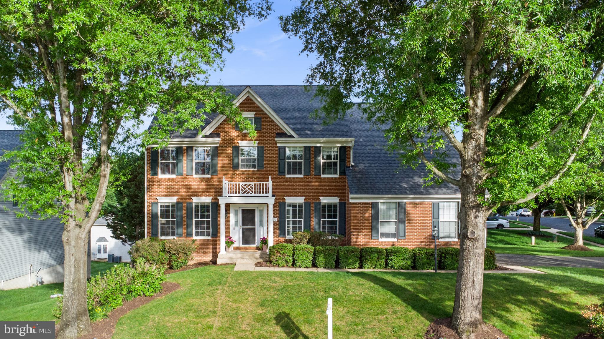Now Presenting this Nearly 4,500 Sq. Ft. Stately  Brick-front Colonial Home With Portico Roof Over Main Entry 4 BR / 3 BA / 1 1/2 BA Home With Walk-Out Basement and Side Loading 2-Car Garage on Elevated Over 1/4 Acre Corner Lot in the Popular Ashland Reserve Community in Manassas near Montclair. Upon entry to home, you are greeted by two level vaulted foyer, grand staircase with oak hardwood flooring and white railings leading upstairs, oak hardwood flooring throughout most of the main level and traditional floor plan. To the left of the front door is sitting room / reading room with extended crown molding and formal dining room with wainscoting and extended crown molding. To the right of the front door is coat closet, main level powder room and newly painted main level office with French Doors. Navigating through the home, you reach huge open floor plan kitchen with continued hardwoods and great room combination with carpet that both are equipped with extra sunny windows, have views of the gas log fireplace, stylish ceiling fan and have adjacent main level exit to the back yard that includes beautifully maintained and oversized deck with two sided privacy pergola, making it ideal for exterior entertaining. In the kitchen, you are greeted with Recessed Lighting, 42 Inch Oak Cabinets, Kitchen Island, White Appliances, Corian Counters, Coffee Bar counter, Walk-in Pantry and Bay Window that transitions to breakfast area and mud room with access to the huge 2-Car Side Load Garage. Upstairs you are met by foyer overlook with hardwood flooring that leads to four bedrooms upstairs all with ceilings fans and carpet. Newly painted primary bedroom includes sitting area, two separate walk-in closets across the hall from each other and primary bathroom with brand new flooring, dual vanities, soaking tub, private enclosed commode and step-in shower. Three other bedrooms all include large closets and share the second full bathroom upstairs with dual vanity counter, soaking tub and shower combination. Laundry room is upstairs with newer LG stackable washer / dryer and extra storage.  Downstairs is a walk out level basement that has an open floorplan with a huge additional living area that includes a third full bathroom and second exit to the back yard, with second exterior patio living area on the ground level and yard with irrigation system. The basement also includes a separate finished area that can be used as a fifth bedroom, or den / study / office and has a large unfinished storage area with shelving. ***Pool Table Conveys*** Roof was replaced within last ten years, HVAC is 2018 Carrier Infinity Series and Water Heater was replaced in 2019.  Home is also equipped with window treatments throughout most of the home. Ashland Elementary School is nearby in the neighborhood and the school pyramid is Ashland ES / Benton MS / Forest Park HS. Home is located towards the end of two No Outlet streets, so it is not located on a traffic pass through road in the neighborhood. Community includes tot lots, trails, large outdoor pool, pickleball / tennis / basketball courts and community events. This beautiful home was a model for the community when it it was built and is quite a value in a sought after community, do not miss the opportunity!
