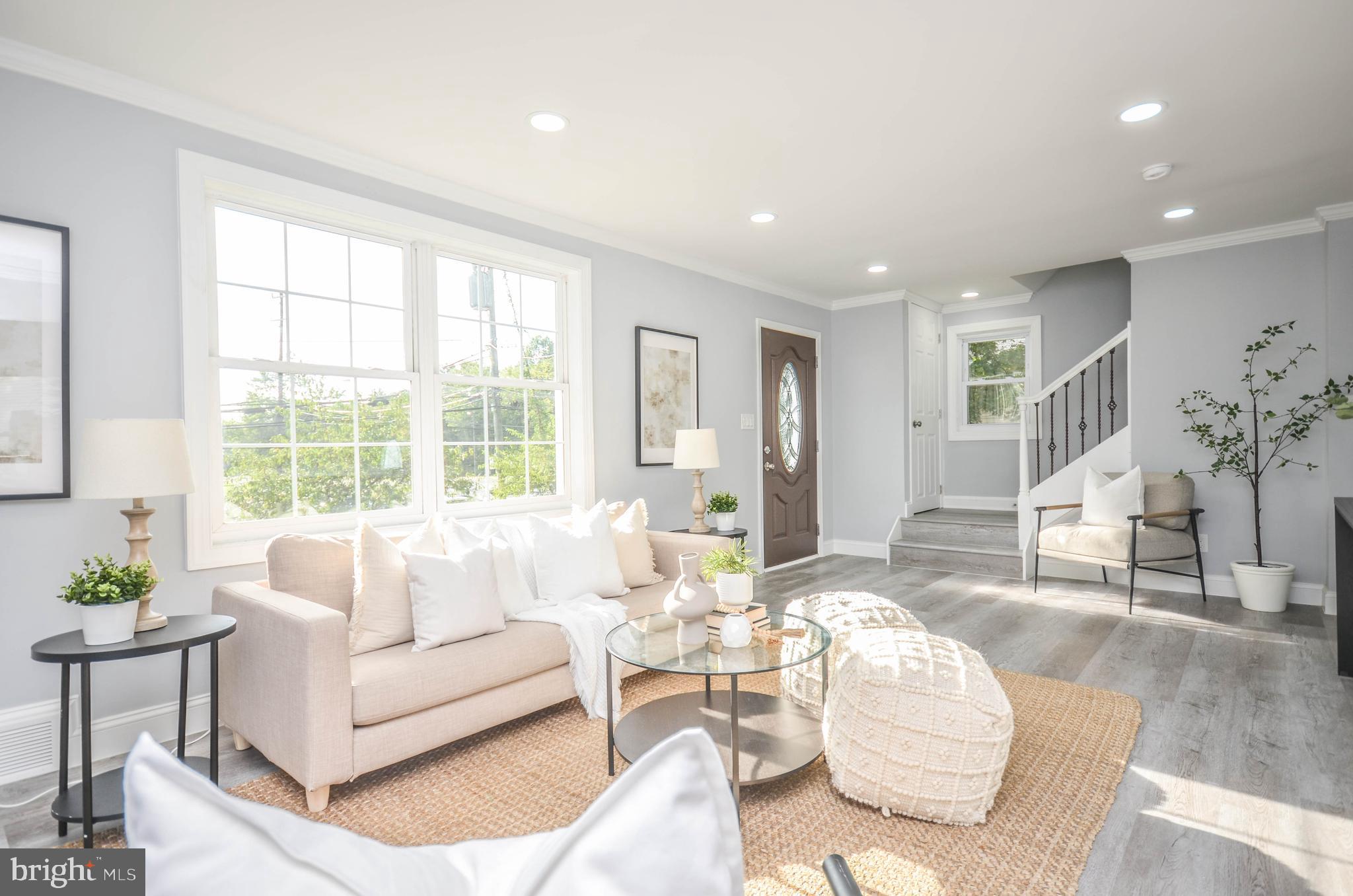 Seller is offering up to 3% closing credit!! This beautifully renovated 4-level brick colonial is a must-see! The main level features a sunny living room with electric fireplace and an updated kitchen with quartz countertops, slow-close cabinetry, and stainless steel appliances, all open to a spacious dining room. Off the dining room, you'll find a versatile bonus room or office. The upper level includes a landing with a cozy sitting area, a master bedroom with a private bath, and a sizable second bedroom. The top level boasts a finished attic, perfect for a 4th bedroom. The fully finished basement offers even more living space, including a den, a 4th bedroom, a wet bar, and an updated full bathroom with a tile shower. This home sits on a large lot, conveniently located near the University of Maryland, major commuter routes, and public transportation. The driveway and rear parking pad provide off-street parking for multiple vehicles.