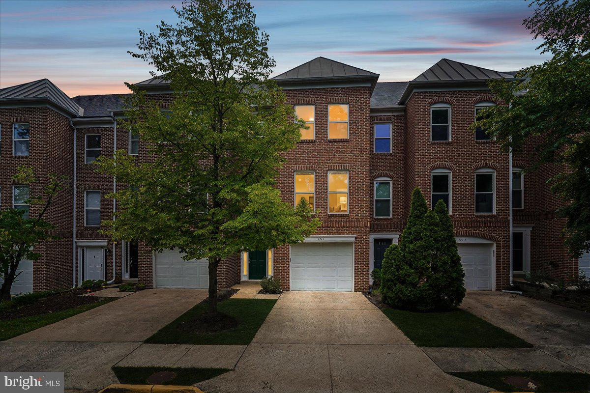 This spacious, low maintenance, brick townhome offers 3 levels of luxurious living space, 4 bedrooms and 3.5 bathrooms perfectly situated within walking distance from the vibrant and highly sought-after Reston Town Center.  This charming and modern townhome is a move-in-ready gem featuring an open-concept floor plan designed for effortless living.

The Entrance Level welcomes you with a spacious hardwood floor foyer and convenient attached garage access. This level also includes a stairs free versatile walk out bedroom or living space with attached bathroom. Laundry room with washer and dryer included.  You will also enjoy direct access to your private, fenced, covered, outdoor sanctuary. 

The Main Level serves as the heart of the home, where a bright and airy layout seamlessly connects the kitchen, dining, and living areas. With lots of natural light, 9ft ceilings and open concept this floor is ready for living!  And living extends outside through large glass doors that lead to your private, elevated deck—perfect for morning coffee, evening relaxation and gathering with guests.  On chilly days, you can cozy up by the beautiful gas fireplace. The delightful eat-in kitchen includes a new gas stove, high-end GE appliances, and an abundance of beautifully maintained wood cabinetry, large windows that keep the space fresh and bright.

The Upper Level is a dedicated retreat for rest and relaxation, featuring a Primary Suite with vaulted ceilings, a generous walk-in closet, and a private en suite bath. Two additional bedrooms with ample closet space and a third full bathroom ensure that everyone has their own peaceful sanctuary.

This home is thoughtfully maintained. Notable recent updates include New roof installed (2024) New exterior paint (2023) New interior paint throughout (2026) NewLVP flooring (2026), New carpet (2026)

Key Features:

  - Spacious Layout: 4 bedrooms, 3 full baths, and a convenient powder room
  - Private Outdoor Oasis: Partially fenced yard and a private second-story deck
  - Modern Comforts: Reliable furnace/AC (2012) and water heater (2011)
  - Modern Kitchen: New gas stove and stainless steel GE appliances
  - Parking: Attached garage, private driveway, and ample guest parking

Nestled within a warm and welcoming community, you will enjoy exclusive access to an outdoor pool and a clubhouse featuring a fitness area.  This premier location offers direct access to Reston's famous scenic biking/walking trails and is just steps away from the world-class dining, upscale shopping and entertainment that is offered in Reston Town Center.  Short walk to Trader Joe's and a brand new Whole Foods. Commuting is a breeze with a 10 minute walk to the new Silver Line Metro Station connecting you to Northern Virginia, Washington DC, and Dulles International Airport. As an incredible bonus, the neighborhood benefits from a local hospital micro-grid, providing such exceptional power reliability that there has not been an outage in years!

 Do not miss this wonderful opportunity to own a fantastic property and start your next chapter in style!