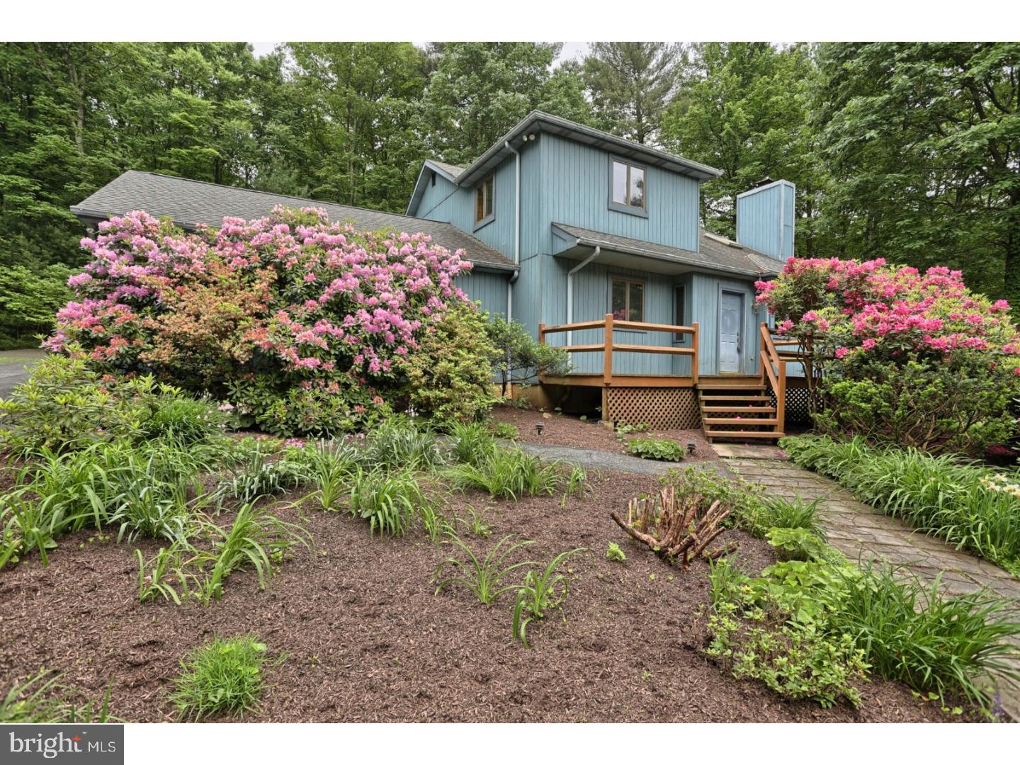 Hidden from the road and nestled in a wooded lot consisting of 1.20 acres is where you'll find this well cared for home. Nature abounds from every window. Upon entering the front door, you are immediately greeted with an eye-catching floor to ceiling brick woodburning fireplace in the 2-story vaulted ceiling living room with skylights. This flows nicely into the dining room with French doors leading to a screened in porch, perfect for relaxing with a drink while enjoying the abundant wildlife and lovely flowering shrubs. The kitchen is spacious and offers sliders out to the back deck. There is a 1st floor bedroom and full bath, making one floor living a breeze.  Upstairs is the master suite with a private full bath, walk in closet and washer and dryer conveniently located right where you need it. This is also where you'll find the loft which can be used as a loft bedroom or a hangout room ? you choose. This has sliders out to a peaceful balcony.  Much of the house has been freshly painted in todays neutral color scheme. This house is squeaky clean and ready for new owners! There is a 2-car garage as well as plenty of parking for your toys or visiting family and friends. Whether looking for a weekend getaway or year-round living, you can't beat what Lake Wynonah has to offer! 2 freshwater lakes offering docks, boating, fishing, waterskiing and swimming as well as walking trails, a Lodge with restaurant and bar and community clubs and groups for people of all ages plus so much more, and of course 24/7 gated security. Did I mention, the NEW energy efficient heating and central air system are less than one year old! A quick commute from Harrisburg, Reading, Allentown, New Jersey and more.  Taxes are for al 3 lots.  28-16-2480 & 28-16-2481 & 28-16-2478