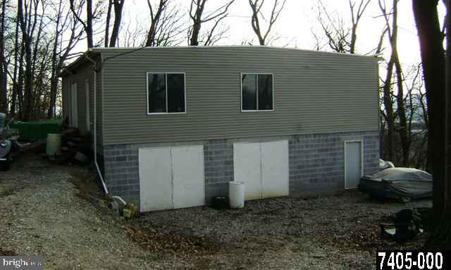 1.55 acre lot in Hellam Township  with 3600 s.f.  2 level garage. Garage built in 2005 has 200 amp electric service. There is an existing well on the property. Seller currently uses the property for auto repairs and parts storage. This is personal use and not a business use. Convenient location and many possibilities for this properties.