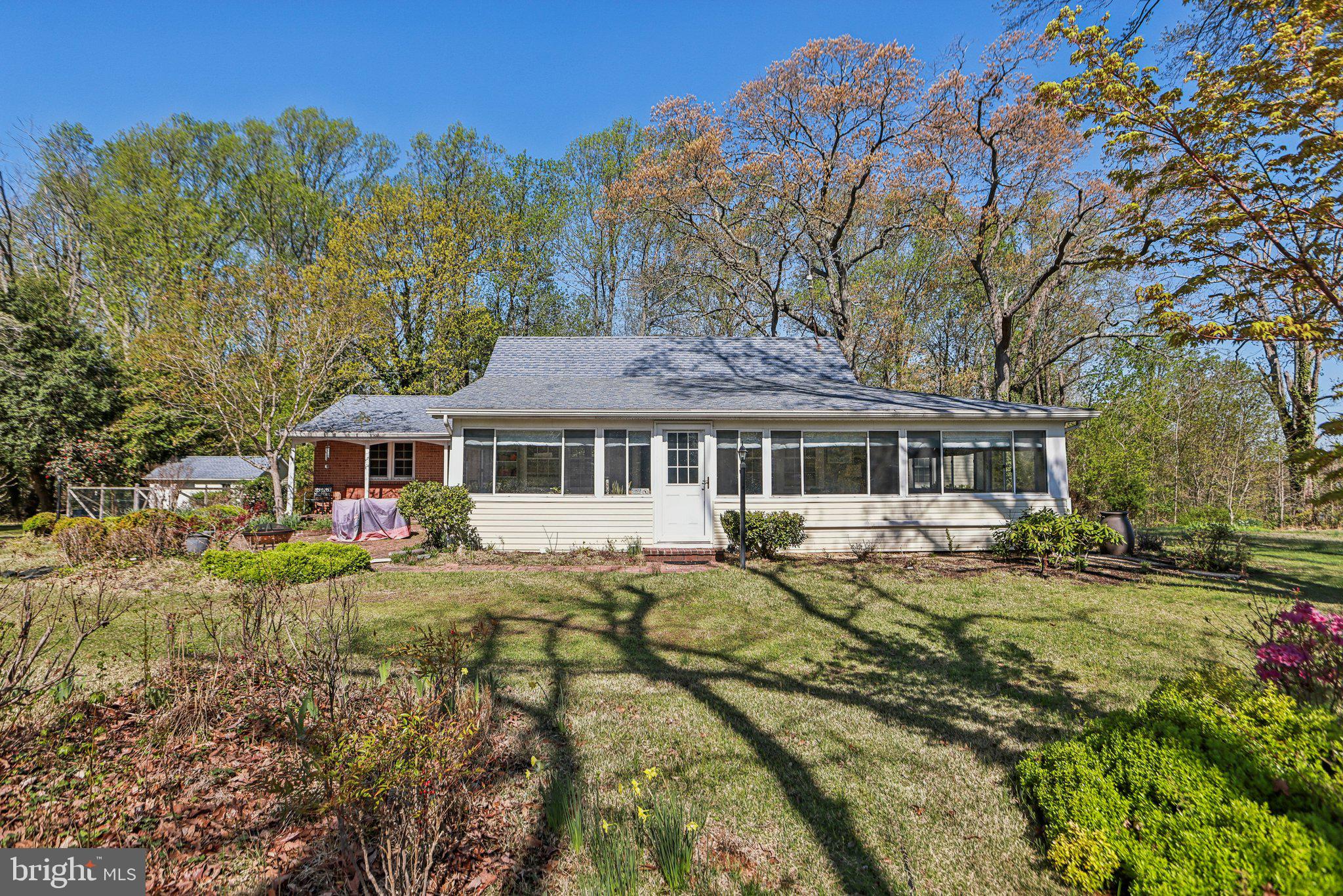 Nestled on 3.56 acres with approximately 1000 ft of waterfront on the southwest side of Kingston Creek, this unique 1940s waterfront property presents a charming rambler offering deep, protected waterfront just minutes from the Patuxent River. The beautifully landscaped private setting boasts fantastic views of the creek and river from all sides. Enhancements include a new wood stove in 2023, updated some flooring, fresh paint, and the addition of mini splits. The home also features an updated primary bath. Outside, a 60 ft pier with a 12 ft "L" and 4 slips, accommodating up to a 40' boat with an 8' MLW, complements the beautiful yard and views of the water. Inside, the updated kitchen offers an island, breakfast area, beamed ceiling, and brick fireplace with heatilators, while the dining and living rooms feature hardwood floors and another brick fireplace. A wrap-around 4 seasons room
 and the master bedroom provide further water views. Bedroom #3, though smaller, offers a water view and built-ins suitable for an office. A large brick patio overlooks lovely gardens with numerous flower beds, mature azaleas, and unique trees and shrubs. 
The property enjoys easy access to Solomons Island and Patuxent Naval Base.