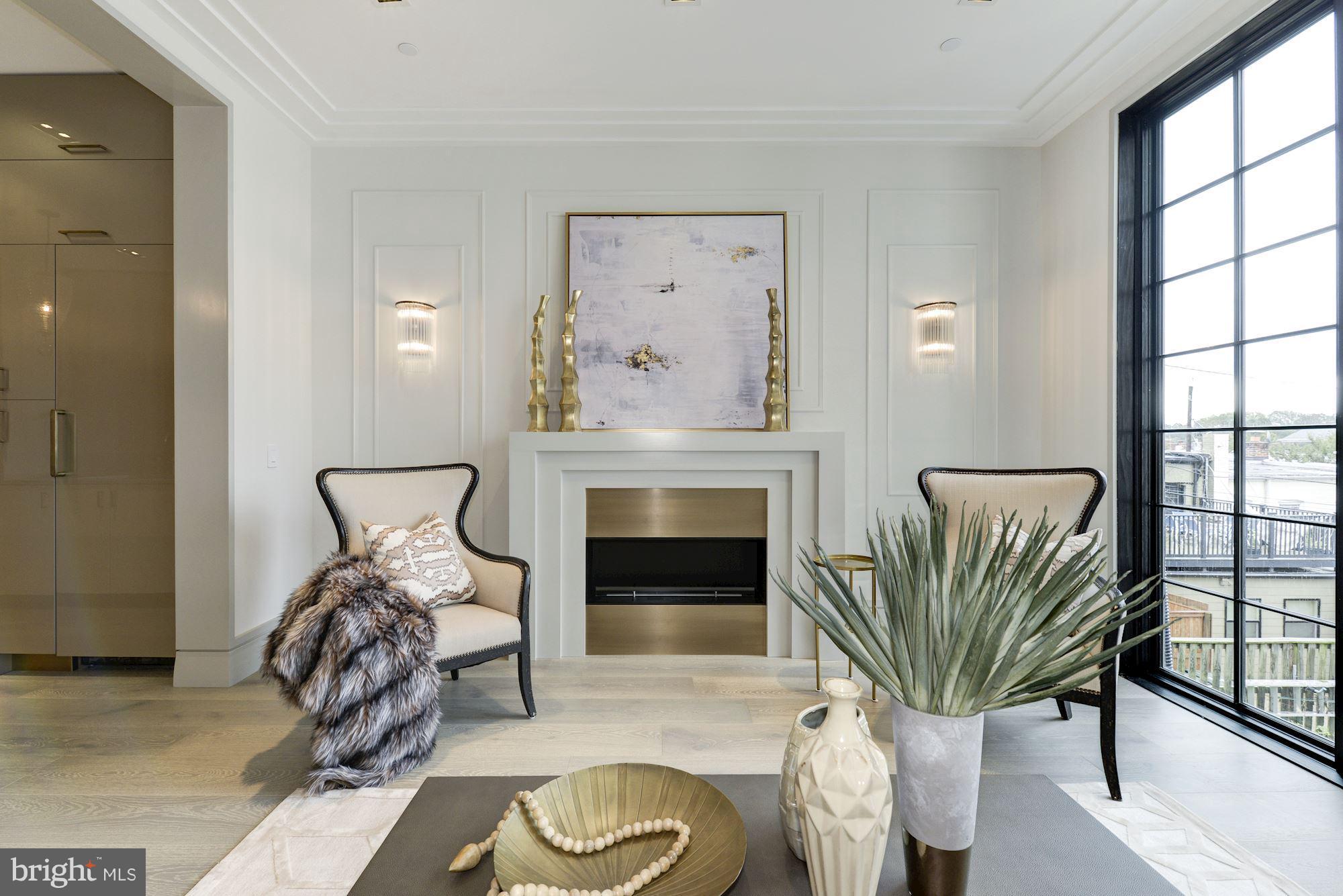 This is truly a bespoke home with sexy, contemporary design throughout. It has EVERYTHING we all want in a DREAM HOME. The spectacular kitchen is the heart of the home. Massive windows & views of DC. Elevator to all levels. Custom detailed millwork & staircase. Multiple living areas for entertaining. Deep private garden. Dog washing station. Two roof decks. Two car parking.