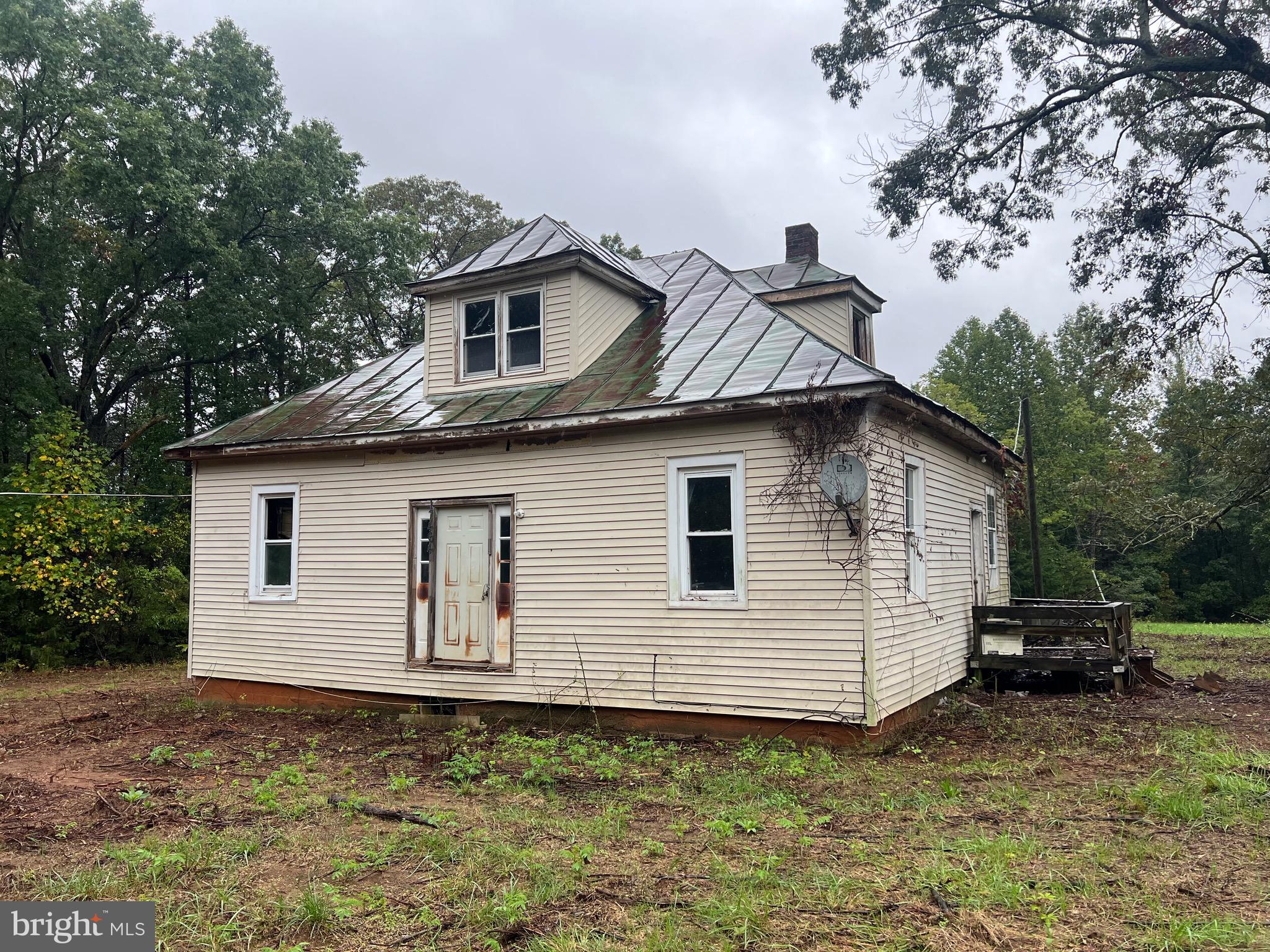 Endless opportunities for this land. It is within 10 minutes of town of Culpeper.  Road , Electric, Well and Septic are in placed.  Enter house at your own risk!!! Property being sold "as is"  House is in need of repairs! Land is deep with a slope flowing in the rear, There is a hunting cabin in the woods.  Easy access to route 29 and the town.    Lovely lot at the end of private road.  Property offers many possibilities.  Choose to renovate the house or tear down, keeping power,  well and septic are in place. Septic is being repaired.