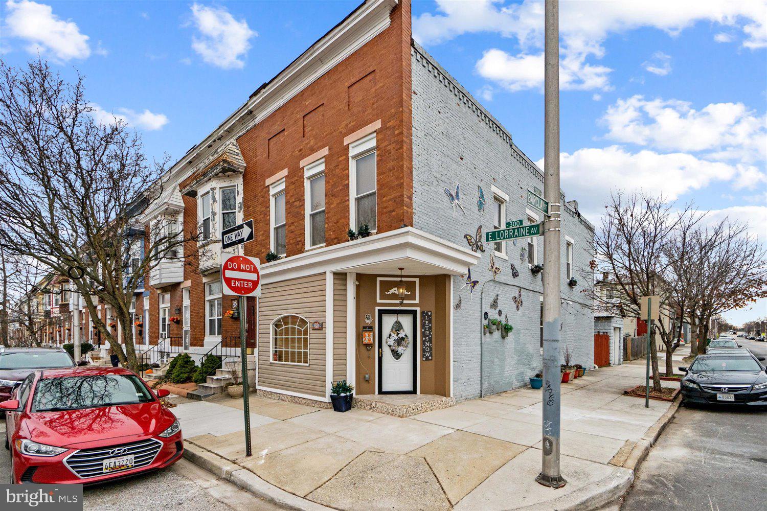 Beautifully renovated, very large, EOG Home that boasts 4 bedrooms, 3 full baths and shows like a  decorator show home.  From the custom artwork on the outside of the home to a large, custom window seat, to the exposed brick you, will be awed by the attention to detail.  Gleaming wood floors lead you to your open floor plan dining room or enjoy your raised, breakfast bar overlooking your gourmet kitchen with custom, wood cabinets and stainless steel appliances.  Convenient first floor Laundry room with brand new high-end washer and dryer.  Step through the rear door and you will be greeted by a wonderful,  privacy fenced-in courtyard, ideal for entertaining or sit around your outdoor firepit with a warm beverage  to be transported to serenity.  The best of city living just got better with your,  very hard to find,  detached garage!  Large bedrooms, featuring your very own Master Suite with ceramic tile bath and his and her vanities.  WOW.  This home has it all and is close to Johns Hopkins University, shops, restaurants and more.   Come visit.  It is even more beautiful in person and you will not find a lovely house for the price in the entire area! 4 bedrooms, 3 Full Bath AND A DETACHED GARAGE! Nothing out there even comes close!