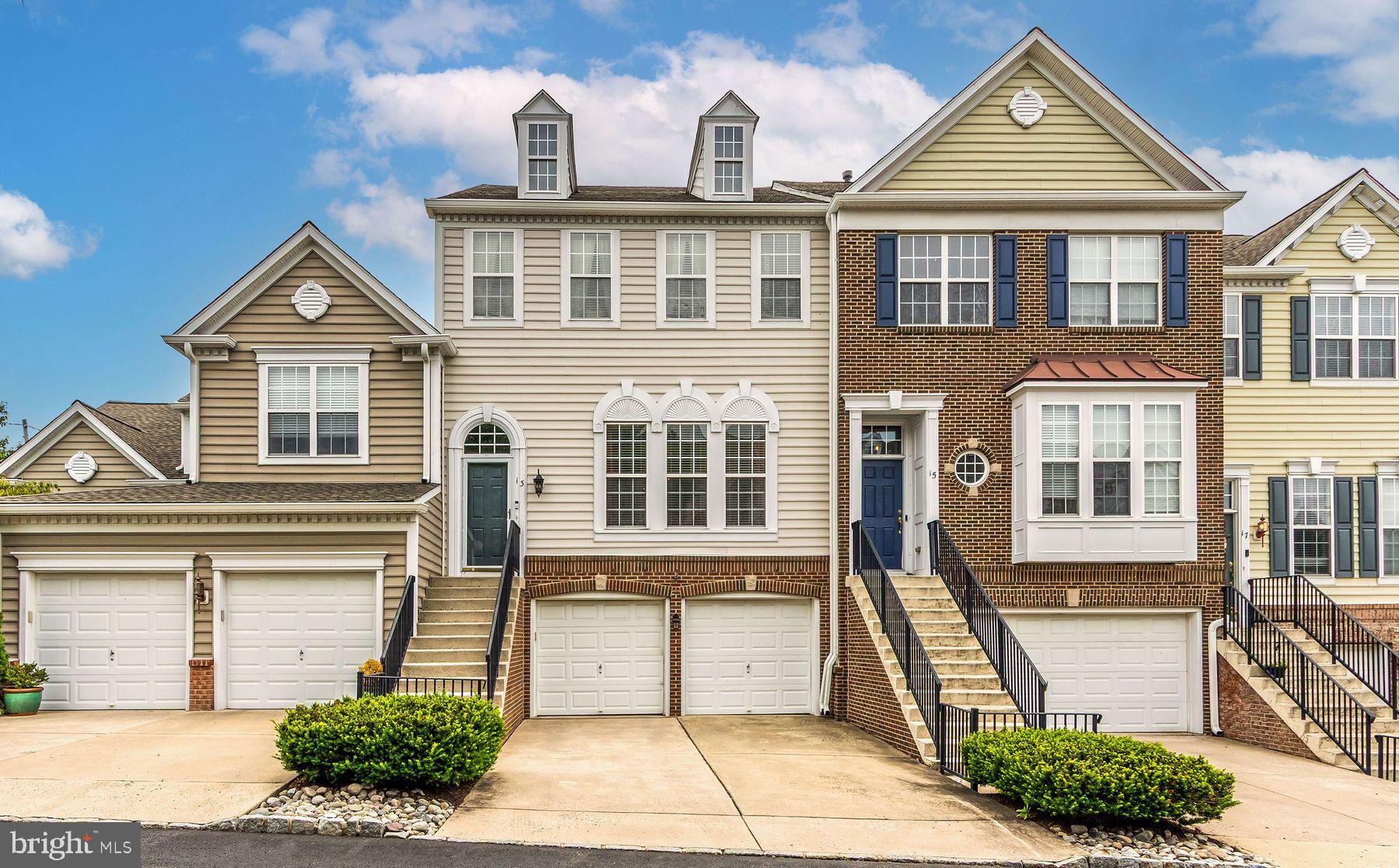 Located in Beautifully Maintained Doylestown Station. This Spacious 3 bedroom 2 ½ bath townhouse/condo provides the versatility of an open floor plan offering Traditional as well as Contemporary flexibility for your decorating ideas! An abundance of windows provides great light throughout. High hat lighting is incorporated into many of the rooms. Raised panel doors throughout add a special touch! The living room, large enough to hold a baby grand piano, looks on to the dining area with crown molding & eye-catching tray ceiling. Both rooms feature attractive wainscoting. These spaces complement each other. What a great place to entertain. There is a half bath conveniently located between the dining area & kitchen with pedestal sink. The kitchen with breakfast area offers tall generous cabinetry, stainless appliances, beautifully coordinated light granite counters & the backsplash is classic beveled white subway tile. The adjacent den/family room is flooded with light, wood floor and a mantled fireplace with travertine surround flanked by tall and decorative eye-catching window. The perfect place to settle down in front of a fire during fall/winter evenings. A private deck area is conveniently accessed off the kitchen/den area. The second floor provides a pleasant & comfortable floor plan. A double door opens to a large primary bedroom suite with tray ceiling, a luxurious ceramic bath with upgraded fixtures, large soaking tub, marble top double vanity sink, ceramic tile shower, walk-in closet with shelving & window. There are 2 additional spacious bedrooms with oversized windows, each with double closet. The hall ceramic tile bath offers a marble vanity sink, tub/shower, linen closet. The finished lower walk-out level with a large window, high ceiling & accent high-hat lighting provides great space for hobbies, crafts, exercise equipment or an additional place to relax with friends & family. There are 3 large closets at this level for clothing/storage. Sliding door from this room open to a paver patio looking on to a lawn with privacy. A real plus is the 2 car garage access from this level with additional side storage space! Enjoy this wonderful community within the Highly Acclaimed Central Bucks School District. Walking trails, green spaces, parks, playgrounds are all conveniently accessible! Minutes to Cultural activities, wonderful museums, music venues, interesting shops & fine restaurants! Make life easy & enjoyable and carefree in this lovely community!