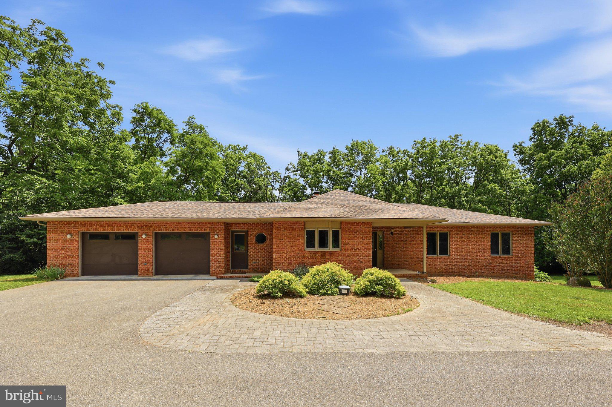 Don’t miss this rare opportunity to own a private, all-brick rancher situated on 10.55 beautiful, sub-dividable acres in Washington County. Offering peace of mind and the perfect blend of main-level living, this 1,863 sq. ft. home features a brand-new architectural shingle roof, a highly functional one-story layout with 2.5 baths, and a massive unfinished basement just waiting for your custom finishes or extra storage needs.

The exterior property features are truly unmatched and designed for entertaining. Imagine relaxing or hosting guests on the large terrace, featuring a partially covered roof and a cozy outdoor fireplace. The acreage also comes complete with a classic 30' X 45' barn and a historic 2 story spring house. Whether you need abundant space for vehicles, outdoor equipment, a home workshop, or simply want room to stretch out and enjoy nature, this property delivers it all.  A truly unique offering with endless potential!  Things to note: Roof 2026, HVAC (inside 2024, outside 2026), Hot water Tank 2022