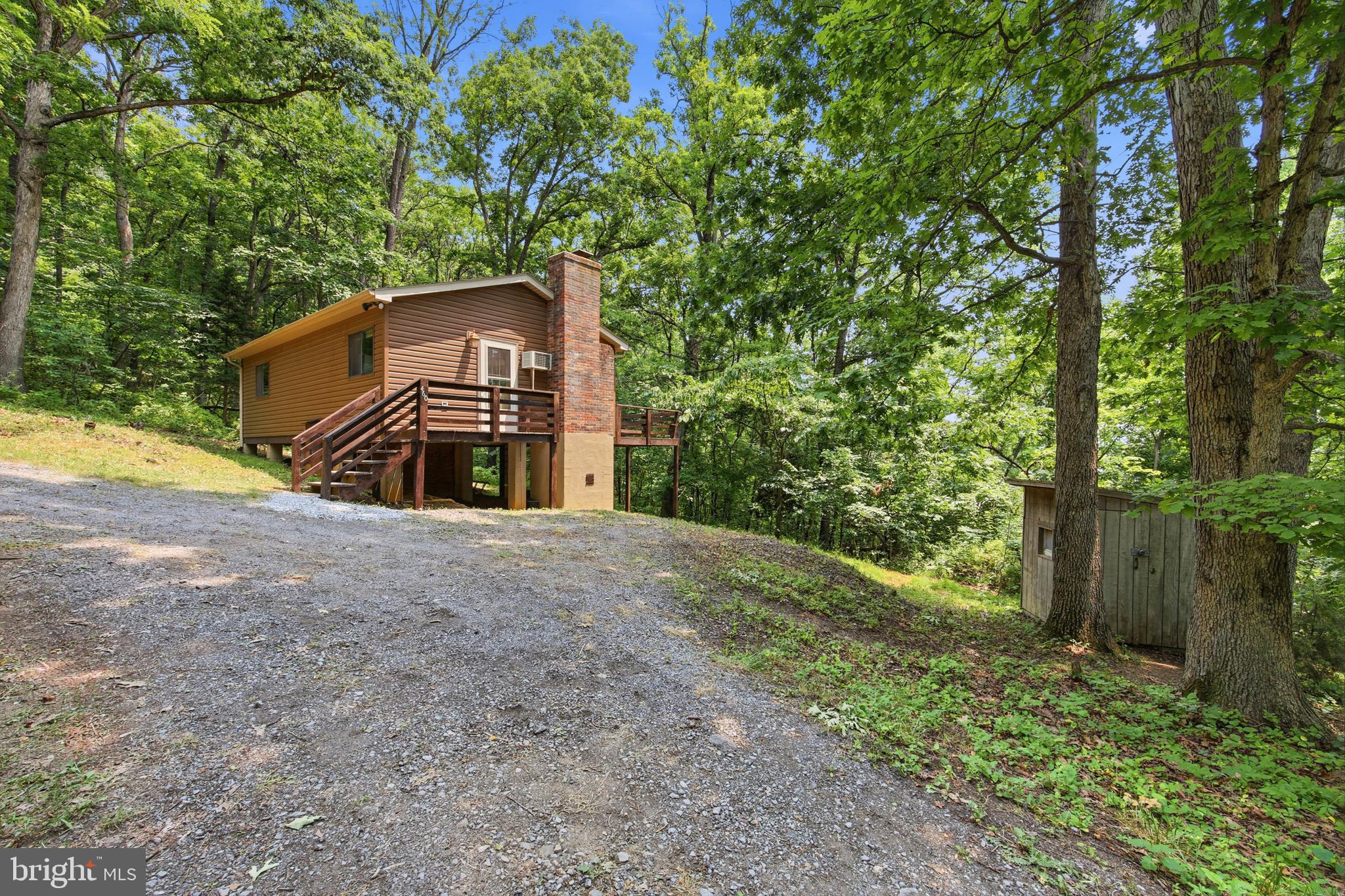 If peace, privacy, and a cozy place to unwind are on your wish list, 460 Hilltop Lane may be just what you’ve been looking for. Set on 3 wooded acres, this inviting 2-bedroom, 1-bath home offers a quiet setting with plenty of room to enjoy the outdoors.
Inside, luxury vinyl plank flooring runs throughout the home, while the eat-in kitchen provides a comfortable space for everyday meals. The wood-burning stove adds warmth and charm, making the living area especially inviting on cooler days.
Outside, the large deck is perfect for relaxing, entertaining, or taking in the wooded surroundings. A circular driveway offers convenient access, and the storage shed/workshop with electricity provides useful space for tools, hobbies, or extra storage.
Whether you’re looking for a full-time home, weekend getaway, or investment property, this cozy Mount Jackson retreat offers a simple and peaceful place to call your own.