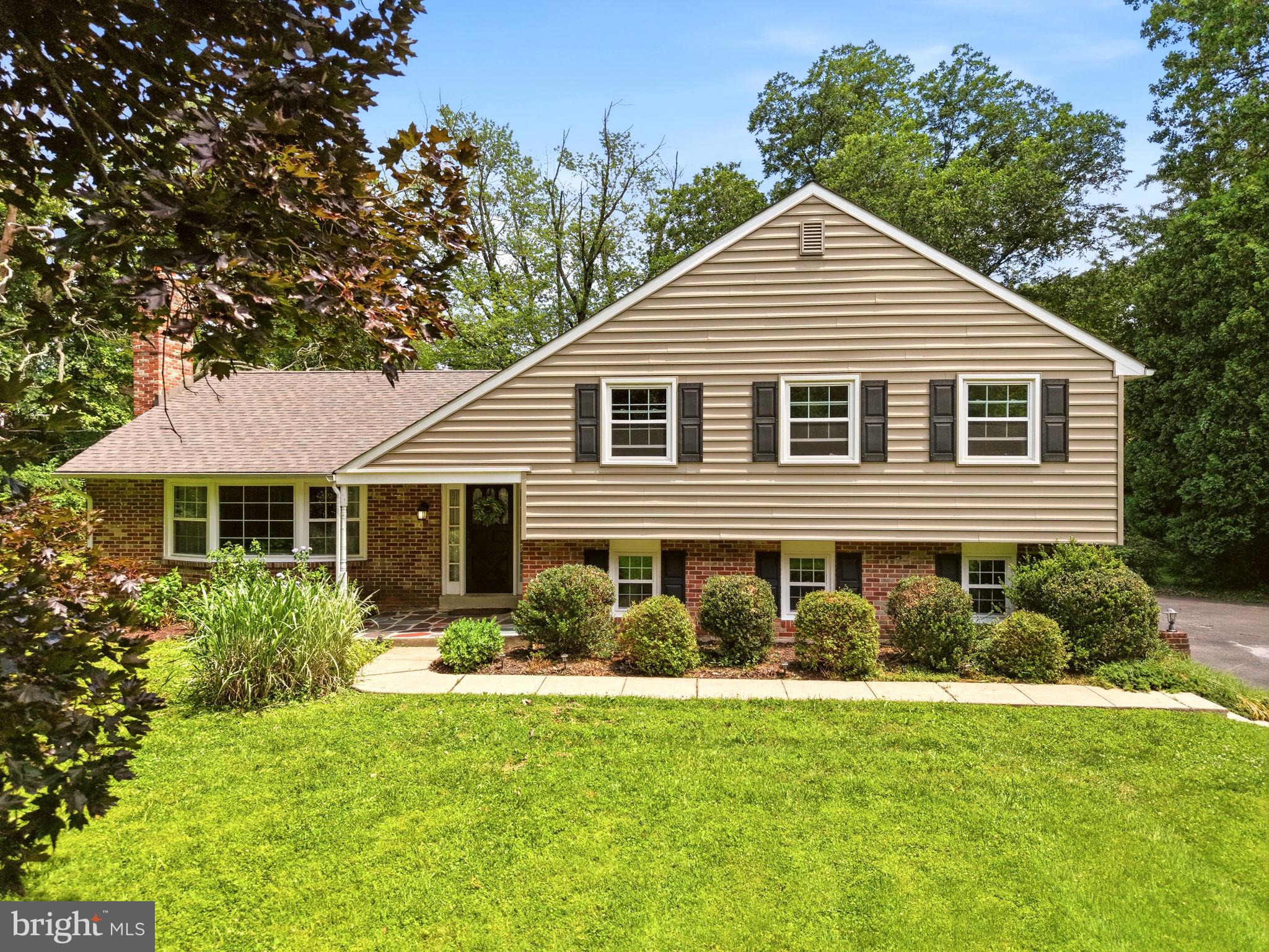 Nestled on a private 1.4-acre lot in the award-winning Unionville-Chadds Ford School District, this well-maintained 4-bedroom, 2.5-bath split-level home offers the perfect balance of space, privacy, and convenience. Surrounded by mature trees and peaceful views, the property features a spacious driveway, attached two-car garage, and exceptional outdoor living spaces designed for both everyday enjoyment and entertaining.

Inside, abundant natural light and hardwood flooring flow throughout much of the home. The updated eat-in kitchen showcases white cabinetry and opens to a designated dining room, creating an ideal layout for gatherings. The inviting living room features a classic brick fireplace and charming bay window, providing warmth and character. A versatile lower-level family room offers flexible space for a recreation room, home office, playroom, or guest retreat, while the garage and unfinished basement provide ample storage and future expansion potential.

Step outside to a covered walk-out patio overlooking the tree-lined backyard, offering a private setting for outdoor dining, relaxing, or entertaining. Tucked away in a quiet location yet just minutes from Routes 52 and 1, Longwood Gardens, shopping, dining, and tax-free shopping in Delaware, this home delivers the best of Chester County living with easy access to everyday conveniences.