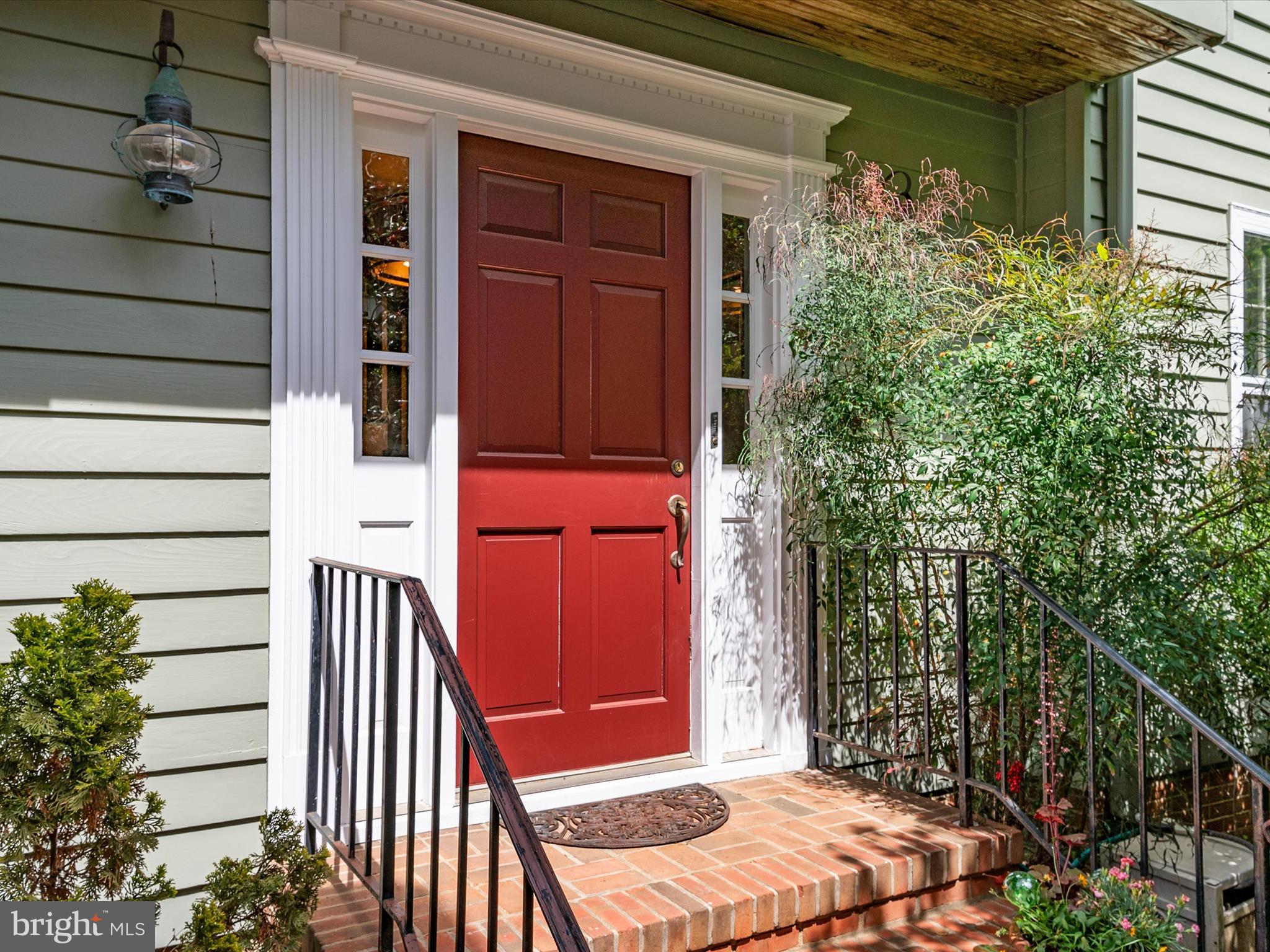 This historic, charming downtown home has been beautifully updated by the current owners and offers so much of what downtown residents seek - private off-street parking; an elevator to the second floor; a private courtyard; basement storage space, and a lushly planted, fenced garden and patio.  The formal living and dining rooms, both with wood burning fireplaces, provide ideal spaces for entertaining.  An office nook and sunroom are cozy places to relax and enjoy views of the walled garden. Upstairs, the three bedrooms each have an ensuite full bath, and laundry facilities are conveniently located off the hallway.  The third floor can be used as an additional bedroom, home office, or play room.  Recent improvements include new kitchen (2024), roof (2023), two skylights (2023), hot water heater (2022), exterior paint (2023), wired smoke and CO2 alarms (2022), bathroom updates, and many new light fixtures. This home, built in 1855, has hardwood floors and numerous original details. This is a fabulous opportunity to live in historic Annapolis with plenty of room for family and guests, beautifully designed outdoor spaces, and off-street parking. Ideally located equidistant from Spa Creek - where you can launch a kayak, paddle board, or hop on a water taxi -  and downtown Annapolis with its restaurants, shops, art galleries, and music venues.