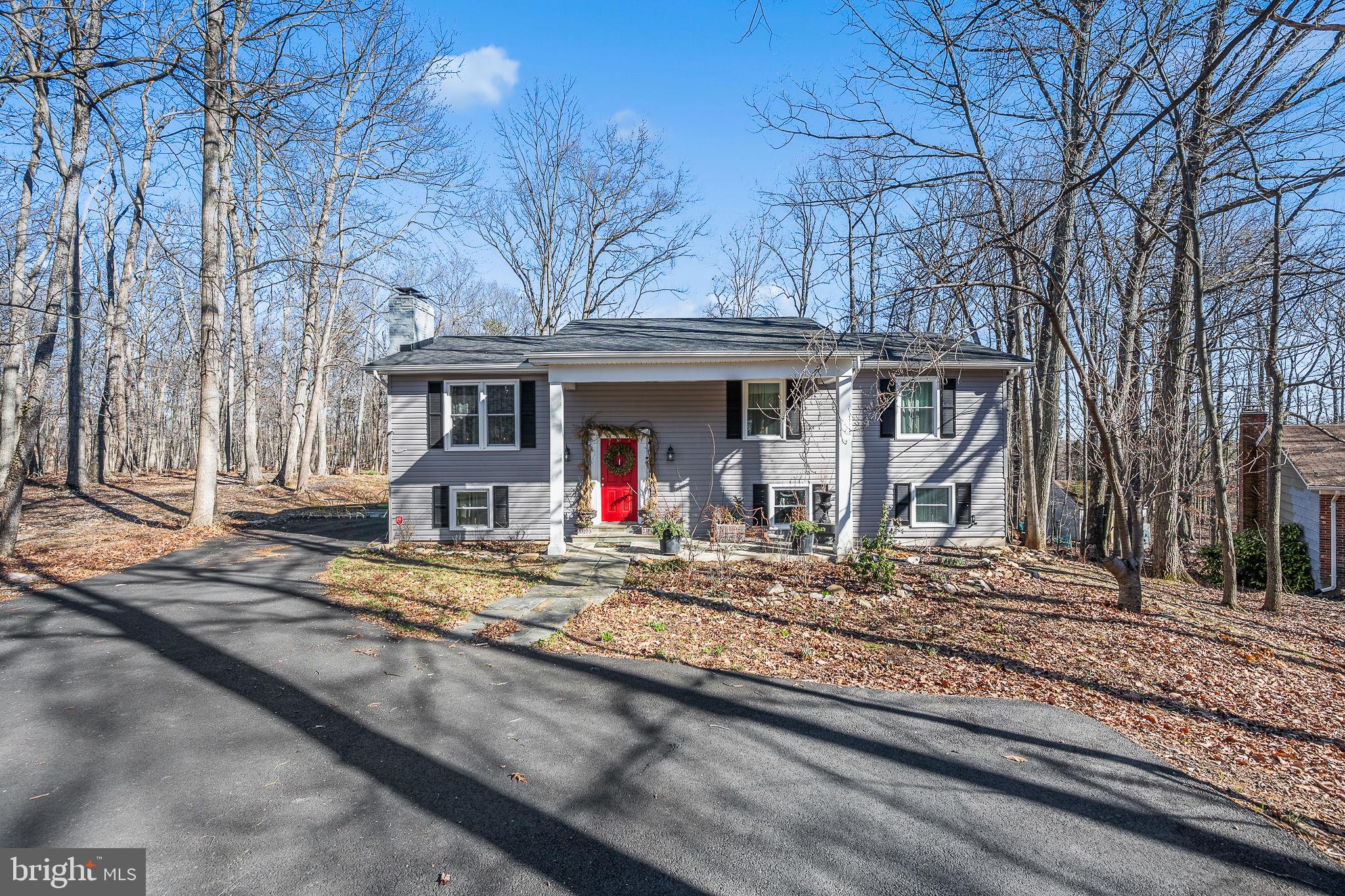 This beautifully updated single-family home offers a rare opportunity to enjoy a premium setting with modern upgrades throughout. Designed with an open and inviting floor plan, the home features four spacious bedrooms and three full bathrooms, providing flexibility and comfort across multiple levels. Luxury plank flooring adds warmth and durability, complementing the bright, refreshed interior.

The kitchen is thoughtfully designed with a stylish stone backsplash, stainless steel appliances, and ample workspace, making it ideal for everyday living and entertaining. The fully finished walkout basement expands the living space and includes a private bedroom, a full bath, and a cozy fireplace—perfect for guests, recreation, or a home office.

Outdoor spaces are equally impressive. A large front porch welcomes you home, while the rear deck overlooks a generous, wooded backyard that offers privacy and room to enjoy the outdoors. A newly paved asphalt driveway provides ample parking and enhances curb appeal.

Major updates completed in 2022 contribute to peace of mind and move-in readiness, including renovated bathrooms, updated windows, HVAC system, water heater, siding, doors, gutter system, and deck. Every detail has been carefully considered to create a home that blends comfort, style, and functionality.

Ideally situated near the foothills of the Blue Ridge Mountains, the property enjoys a desirable balance of scenic surroundings and convenience. The rolling landscapes of Virginia’s renowned horse country lie to the west, while shopping, dining, and everyday amenities in Manassas are just minutes to the east. Commuters will appreciate easy access to Washington, D.C., located less than an hour away.

This thoughtfully updated home offers space, versatility, and a prime location ready to be enjoyed.