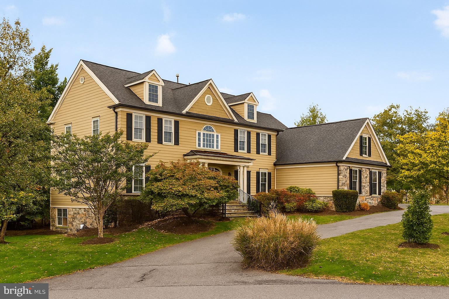 New Roof and gutters! Welcome to 9914 Woodford Rd, Potomac, MD 20854
This show-stopping Potomac gem offers beautifully-appointed spaces with walls and walls of Palladian windows, many updates including new wood floors and fresh paint, and a fantastic gourmet kitchen & breakfast room ideal for comfortable living and entertaining. The upper level is home to 5 large bedrooms and 3 full baths, including those in the fantastic owner’s suite. A sixth bedroom, a bonus room plus so much more living & entertaining areas are in the walkout lower level. Stylishly updated through out the three-level, 7807+ SF home is minutes to the shops & eateries at Potomac Village and a 20- to 30-miutes drive to DC and VA.
MAIN LEVEL
Wide stone steps with wrought-iron railing lead up to a columned portico, where the entry door opens into a spacious two-story foyer with a winding staircase. Sidelights and transom windows, as well as the numerous Palladian windows in the flanking living & dining rooms awash the foyer in natural light, while new hardwood floors here extend throughout the main level. Thick crown molding adorns the living and dining rooms; the latter also has chair rail molding. The windows all have plantation shutters or blinds.
A double-door study sits off a hall to the left of the staircase, and features recessed lights and windows on two walls. A coat closet and a powder room with a marble pedestal sink are right outside the study.
At the center of the home’s rear, the sunken Great Room lives up to its name with soaring ceilings, a bar, a floor-to-ceiling stone fireplace flanked by Palladian windows and French doors that access the wraparound Trex deck. The deck has a gate and steps leading down to the backyard and side motor court with a three-car garage. Adjacent, the new kitchen boasts newly-painted cabinets, thick Quartz countertops, GE stainless-steel appliances and a center island featuring a 5-burner gas cooktop. There’s plenty of eat-in space at the island, as well as in the attached breakfast/ sunroom with windows all around and a French door to the deck. A large walk-in pantry and the laundry room with a utility sink and a broom closet round out the expansive main level. Access to the attached garage is in this area.
UPPER LEVEL
The curved staircase rises up to the top-floor landing overlooking the foyer and great room. Thick carpet lines the hallway and all the 5 bedrooms. Two large bedrooms sit to the right of the stairs, each with three windows and double-door closets. A Jack-and-Jill bath connects the two rooms and features a double vanity and private toilet room with a tub/shower combination. The sumptuous owner’s suite, with over 220 SF, is behind oversized double doors and features a vaulted ceiling with recessed lights & an overhead fan, a gas fireplace flanked by windows. A short hall contains huge his & hers walk-in closets and a pair of windows offering natural light, ending at the spa-like, all-white owner’s bath. Here, relax in a stand-alone soaking tub under windows, or enjoy a rain shower in the glass-enclosed stall with built-in bench! His/hers vanities and a private toilet room are part of the en-suite bath. On the other side of the stairs, bedrooms 4 & 5 are connected by a bath with two vanities and a tub/shower combo. One of these bedrooms is a loft with a vaulted ceiling, a lighted ceiling fan and a double window nook – ideal for a study or planning desk. A crawlspace closet and a walk-in closet are also featured in this loft bedroom. A hall linen closet completes this level.
LOWER LEVEL
The carpeted basement offers a spacious, open rec room with a window and French door to the yard; an in-law or nanny suite complete with a full window, walk-in closet and a private bath; and a large bonus room with recessed lights (this room can be a home theater, a hobby room, a gym…) A second half-bath, additional storage closets and the utility room round out this level.