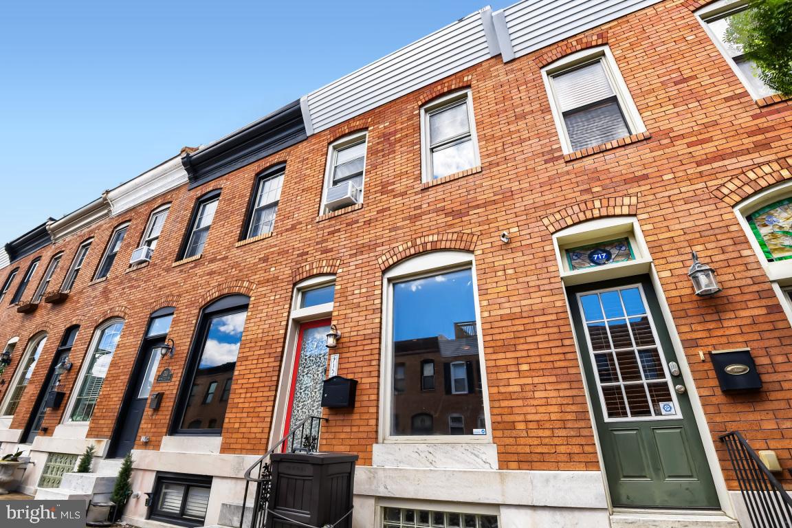 Welcome to 715 S Curley St in the heart of Canton. This classic Baltimore City rowhome offers 3 finished levels, 3 bedrooms, and 2 full bathrooms. The main level features newly refinished hardwood floors in the living room that flow into the kitchen, complete with a walk-in pantry, stainless steel appliances, gas stove, built-in microwave, and dishwasher. Grocery trips are made easy with your own convenient rear parking pad. Upstairs, you’ll find two bedrooms. The front primary bedroom features a beautifully updated full bathroom with a stand-up shower, illuminated mirror and a large vanity with ample counter and drawer space. Two lighted closets on each side of the hallway lead into the front bedroom, adding both style and functionality. The finished basement offers flexibility for a third bedroom, office, or guest space, along with additional storage, a second full bathroom, and a full-sized stacked washer and dryer. Enjoy the incredible walkability to Patterson Park, Canton Square, and Canton Crossing.  You truly never have to leave the zip code.