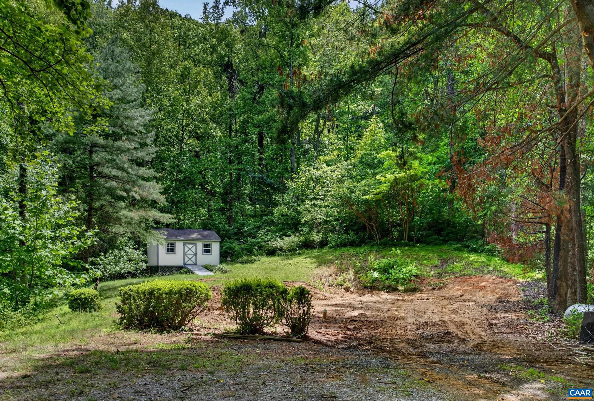 This premium 8.34-acre parcel in Ivy offers a rare combination of total privacy and complete preparation. Located in the Taylor's Mountain Farm neighborhood, the homesite is already cleared and surrounded by mature woods, creating a perfectly secluded footprint for your retreat or custom home. The most time-consuming and expensive steps of buying raw land are already completed for you, as the property features an installed well, an installed septic system, buried power lines, high-speed fiber internet, and a cleared homesite ready to support your build. This is a launchpad rather than a project lot, meaning you can bring your builder and your blueprints on day one. While the property feels entirely removed from the bustle, it offers exceptional convenience. It is located just minutes from the freeway entrance, keeping your commute seamless and providing quick access to the dining, shopping, and amenities of Crozet, Charlottesville, and Ivy. Additionally, families will benefit from the highly regarded Western Albemarle High School district. This is a rare opportunity to bypass the usual development delays and own a large, ready-to-go parcel in a prime location.