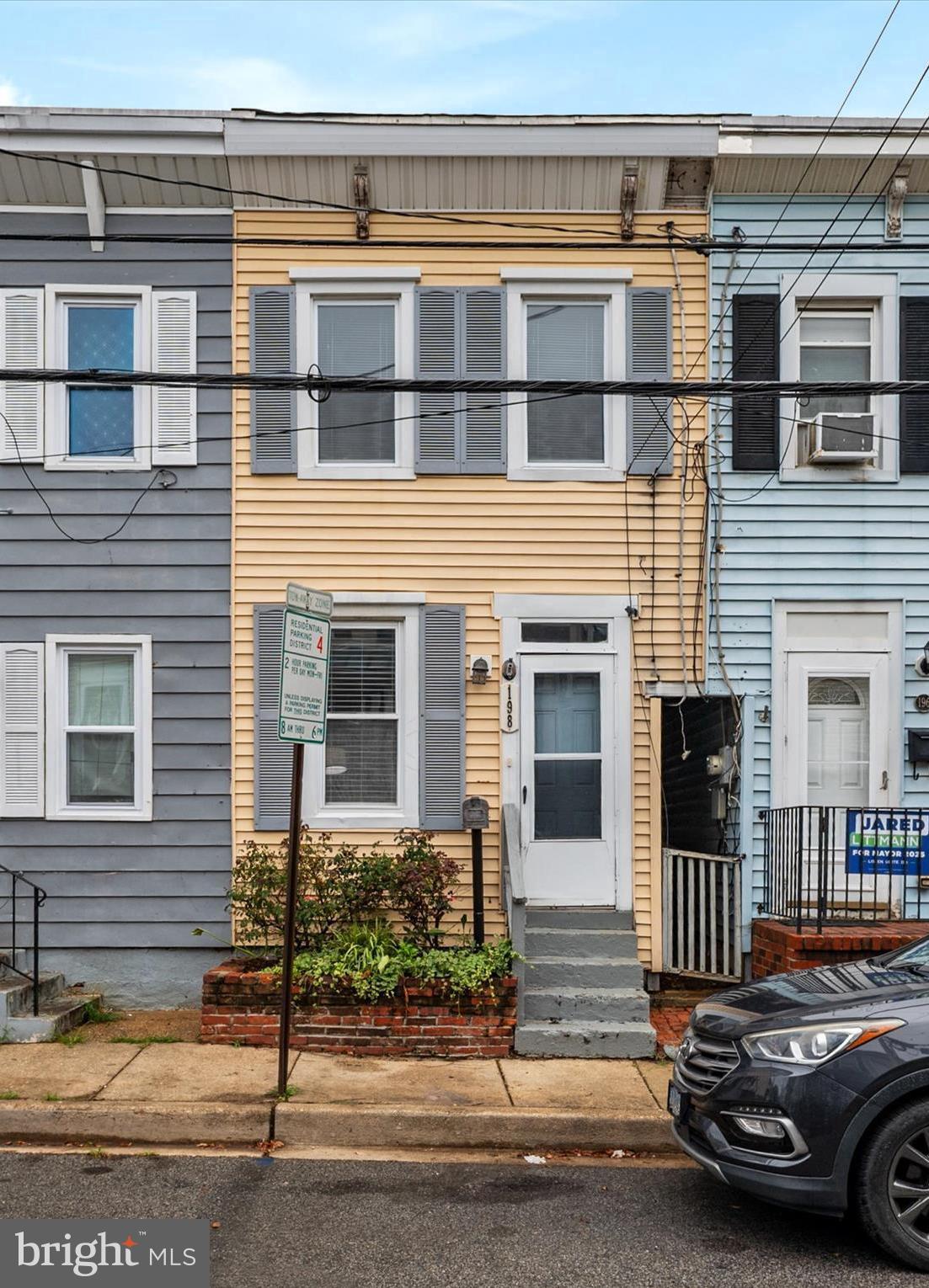 Welcome to 198 Clay Street in the heart of Annapolis! This charming row home offers water views of College Creek and a short stroll to downtown and West Annapolis, where shops, dining, entertainment, and the U.S. Naval Academy are right at your doorstep. The location also provides easy commuter access to Routes 50 and 97 for Washington, D.C., Baltimore, and BWI Airport. Thoughtfully updated in the past year, the home features new flooring and paint throughout, all new kitchen appliances, countertops, and sink, new siding, four mini-split units, and all new upstairs windows. Walls were opened between the kitchen, dining, and laundry areas to create a more open flow, and a new upper-deck door leads to an expanded rooftop deck with water views. Additional highlights include exposed brick and beamed ceilings, a fenced rear yard, private access to College Creek, and rare rear parking. With a proven rental history including $21,500 earned on Airbnb in 2024, this home is ideal as a primary residence or investment opportunity. 
 As of 5/28/26  a new EPDM rubber roof/membrane with additional sealant and chimney closure have been installed.