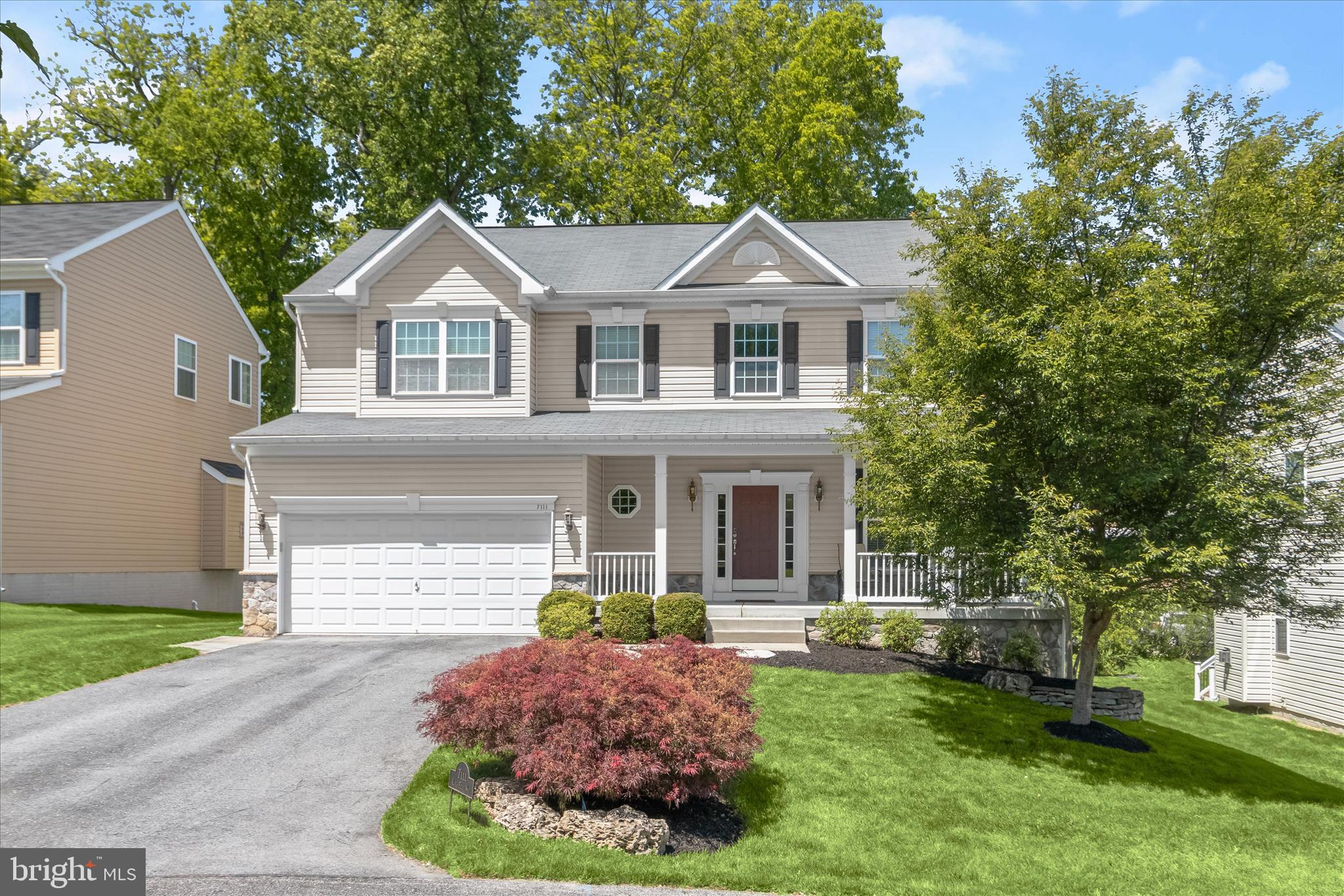 Located in the sought-after subdivision of Kings Cove, an elegant enclave of only seven homes within Kings Contrivance, this exquisite 4-bedroom, 3.5-bathroom home offers the perfect blend of modern elegance and timeless comfort. Constructed in 2014 by renowned builder Dorsey Family Homes, this 4,506 square foot residence offers an open layout and high-end finishes. The soaring two-story foyer immediately sets the tone. The open and airy main level features a harmonious flow between the formal living and dining rooms, both adorned with chair rail and crown molding, leading to a gourmet kitchen equipped with white cabinets, a contrasting espresso island, stainless steel appliances, and granite countertops. The kitchen’s eat-in area opens to a TREX deck, perfect for outdoor entertaining. The family room, complete with a gas fireplace, offers a cozy retreat. 

On the upper level, the primary bedroom is a peaceful sanctuary featuring a tray ceiling, walk-in closet with organizer, and ample natural light from large windows. The primary bathroom is a spa-like retreat complete with a dual sink vanity, soaking tub, and shower stall with a frameless enclosure. Three additional secondary bedrooms provide ample space for family or guests, complemented by a shared hallway bathroom and a linen closet. The lower level is a versatile space, offering recessed lighting, a large rec room with a built-in bar area and wine rack, and a flex room that could serve as a guest bedroom or gym. A full bathroom and a storage & utility area complete this thoughtfully designed level. Conveniently located within walking distance of the Village Center, this home also includes a dual-zone HVAC system, an EV charger in the two-car garage, and a spacious, inviting front porch. One of Columbia’s finest!