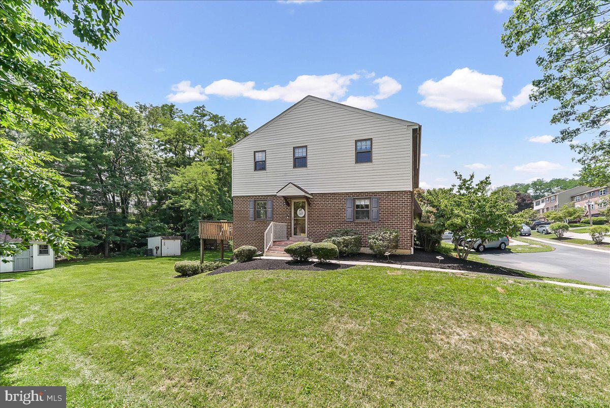 Tucked into a desirable Westtown Township community, this beautifully maintained end-unit townhome offers the perfect blend of comfortable living, thoughtful updates, and outdoor space that's hard to find. Whether you're enjoying your morning coffee on the rear deck, hosting summer barbecues in the expansive backyard, or unwinding after a long day in the finished walkout basement, this home was designed to be enjoyed.

Step inside to a welcoming foyer, complemented by brand-new front steps, that opens to a bright, spacious living room and an inviting eat-in kitchen featuring a center island, stainless steel Samsung appliances (2023), and an adjoining dining area with direct access to the deck—making everyday living and entertaining feel effortless. Hardwood floors flow throughout the main level, while a convenient powder room completes the space.

Upstairs, the primary suite provides a peaceful retreat with a walk-in closet and private bath. Two additional bedrooms and a second full bath offer flexibility for family, guests, or a home office.

The finished walkout basement expands your living space with endless possibilities—whether you envision a cozy movie room, playroom, fitness space, or work-from-home setup. Additional storage, built-in shelving, a utility sink, and laundry area add everyday convenience.

Outside, mature trees create a peaceful backdrop for one of the larger yards in the neighborhood, complete with a charming storage shed for all your outdoor tools and hobbies and plenty of room to play, garden, or simply relax. Recent updates include a new HVAC system (2023), Samsung kitchen appliances (2023), storage shed (2020), upstairs ceiling fans (2022), brand-new front steps (2025), and new screen and deck doors (2025). Just minutes from downtown West Chester, shopping, dining, parks, and major commuter routes, this home offers the perfect balance of privacy, convenience, and everyday comfort.