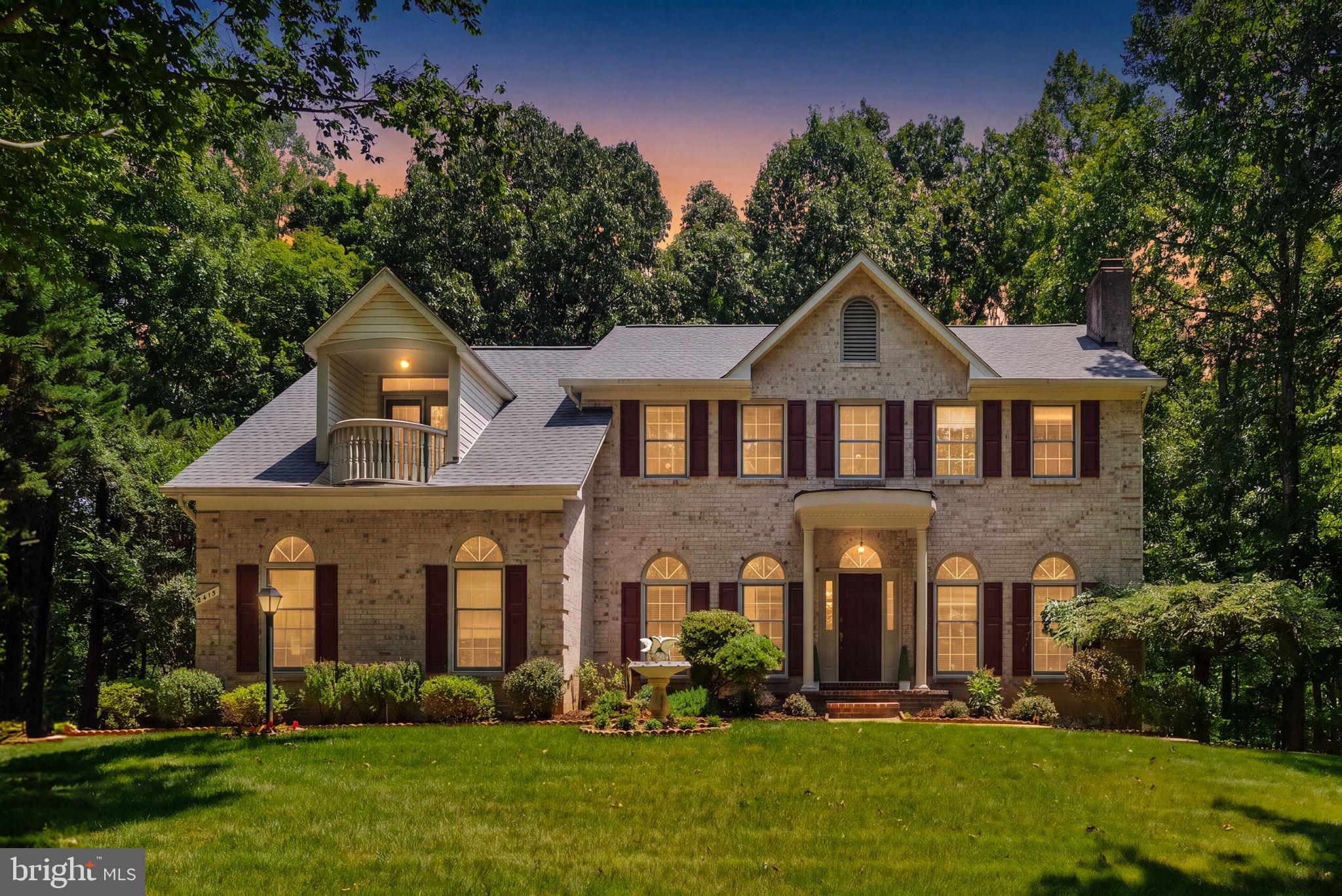 Welcome to 2415 Brighton Place in the beautiful South Wales community!  This spacious and beautifully maintained home offers the perfect combination of comfort, elegance and versatility.  The inviting main level is designed for both everyday living and entertaining, featuring a private home office, formal living and dining rooms and a warm, welcoming family room anchored by a stunning stone fireplace.  The bright breakfast area opens to a deck overlooking the private backyard and peaceful wooded views—an ideal setting for morning coffee or evening gatherings.  Upstairs you'll find a generous owner's suite designed as a relaxing retreat, along with three additional bedrooms and two full bathrooms, providing plenty of room for family and guests. The walk-out lower level offers exceptional flexibility with a large recreation or great room, a full bath, abundant natural light, and direct access to the patio and backyard. Whether you envision a media room, home gym, playroom, guest suite, or additional living space, the possibilities are endless.  With its spacious floor plan, scenic wooded backdrop, and desirable location, this exceptional home is ready to welcome its next owners.  PLEASE REMOVE SHOES WHEN WALKING ONCARPETED AREAS.
