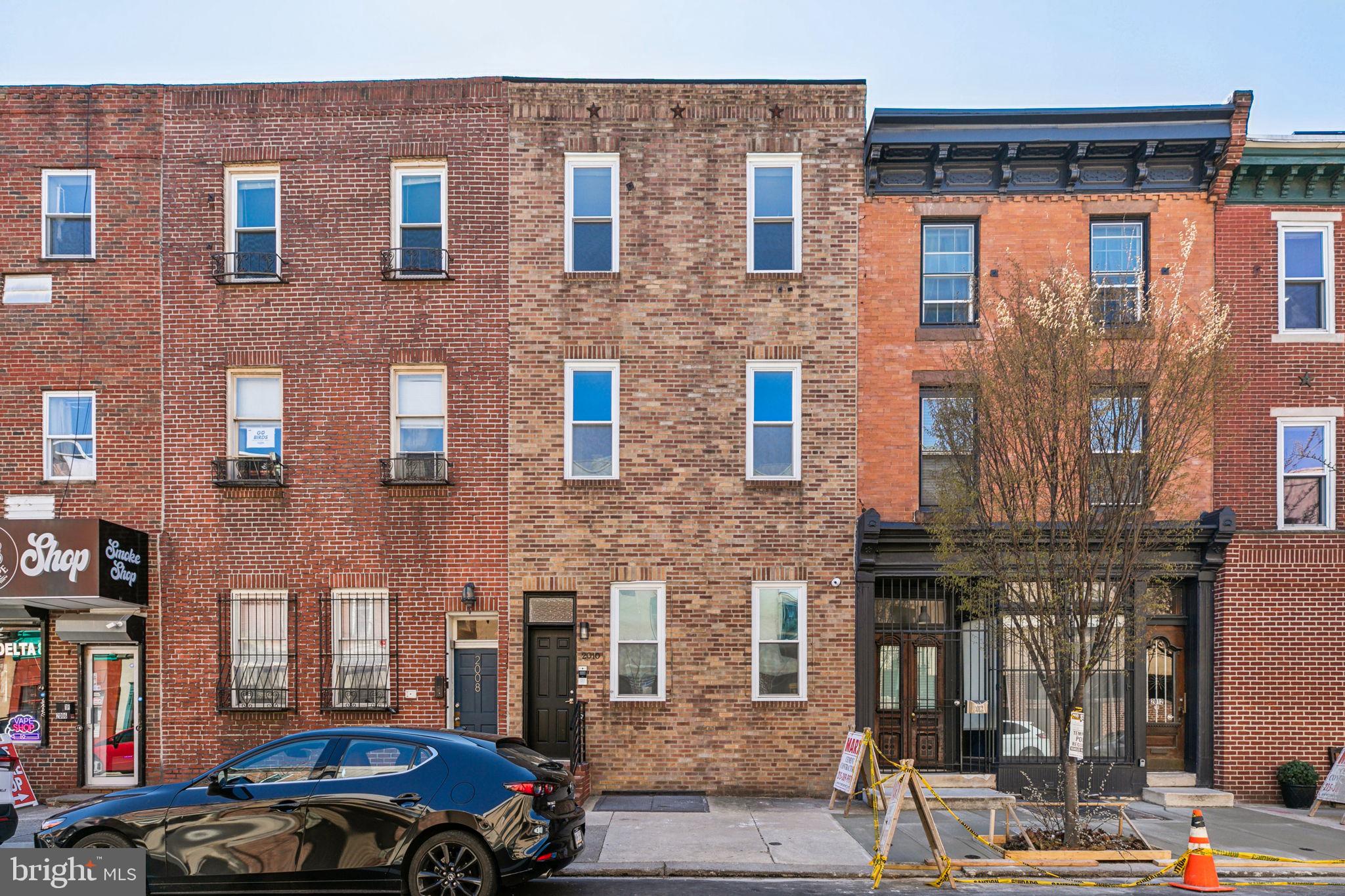This well-appointed 2+ bedroom apartment will satisfy every item on your list. Roof-deck? Check. Fully remodeled? Check. Over 1600 sq ft, with high ceilings, in a central location near Fitler, Rittenhouse, and South Square? Check, check, check! Upon stepping into this bi-level unit, notice the beautifully tiled entryway and contemporarily styled stairway to the main level. Hardwood cherry floors carry throughout the entire home. The exceptionally large great room features real wood-burning usable fireplace, with reclaimed wood mantle. This floor features high ceilings, recessed lights, and ample storage. The tasteful kitchen features gas range, quartz countertops, custom herringbone backsplash, and soft-close shaker cabinets. Very well lit, with both natural and abundant LED lighting. Large pantry and coat/cleaning closets available in hallway. Newly renovated bathroom serves the main floor, with finishes to satisfy the most discerning taste. The secondary bedroom completes this main story floorplan. The entire upper story is dedicated to the primary suite. Newly refinished, large trex deck, with sunny southern exposure and excellent privacy. The new washer and dryer are just outside of the primary bedroom, conveniently. A large landing at the top of the stairs has potential to serve as family room, home office, nursery, den, or any other use you can envision for this bonus space. The primary suite features walk-in closet with organizers, secondary closet, and beautifully remodeled en suite with rain shower over tub. New HVAC system serves the property, heating and central AC. Energy efficient appliances. Built-in smart-device-connected home security system, with multiple cameras, allows you to easily monitor and provide access to your home from your phone. The location, at the quiet end of South St, is convenient and central to many of Philadelphia’s most beloved restaurants, parks, nightlife, museums, city social clubs, and recreation. Properties like this don’t come available often — schedule your tour today!