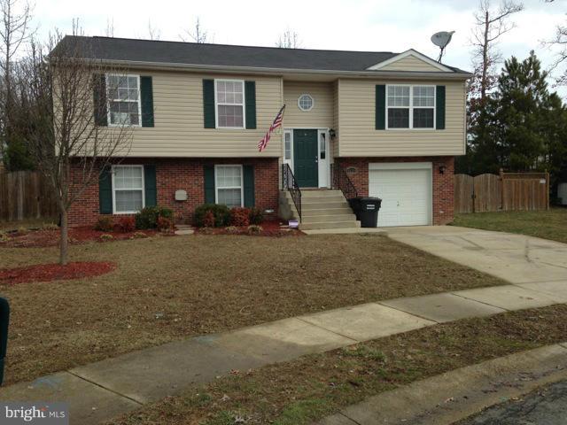 LOOKS LIKE A MODEL!  4 bedrm 3 full baths. H/W floors in kitchen and dining room. walks out to large deck, steps down to fenced backyard, large shed.  GARAGE. Beautiful Granite counters in baths. Tile floors.  jetted soaking tub. brush nickel fixtures throughout. 2 master suites, great for in-laws or room mate situation. Convenient location to everything!
