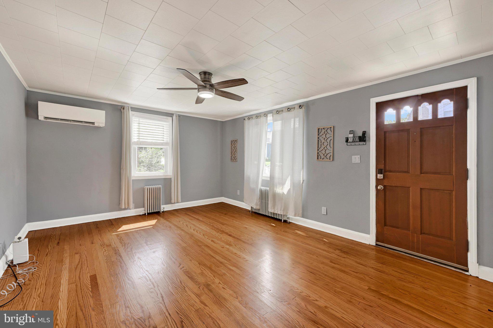 THE HIGHLIGHTS: Brand New Kitchen | Main-Level Primary Bedroom | Finished Lower Level w/ Rec Room + Full Bath with Walk-Up Exit | Sun-Filled Dining Room | Large Fenced Backyard | New Roof (2018) | Boiler (2022) | Mini-Splits (2023) | New Sewer Line (2023) THE DETAILS: Move right in and enjoy. Everything has been done for you! This Cape Cod has been thoughtfully updated from top to bottom. The heart of the home is the beautifully renovated kitchen, designed for both everyday living and entertaining. A sun-filled dining room creates a warm, inviting space for gathering with family and friends. The spacious main-floor primary bedroom is conveniently paired with a full bath, while the fully remodeled lower level expands your living space with a large recreation room, an additional full bath, and endless possibilities for hosting guests, game nights, or a home office. Step outside to a generous backyard with plenty of room for gardening, play, pets, or simply relaxing outdoors. Enjoy peace of mind knowing the major updates have already been completed, including a new roof (2018), boiler (2022), mini-split system (2023), and new sewer line (2023). This move-in-ready home offers comfort, style, and worry-free living, all in one adorable package!