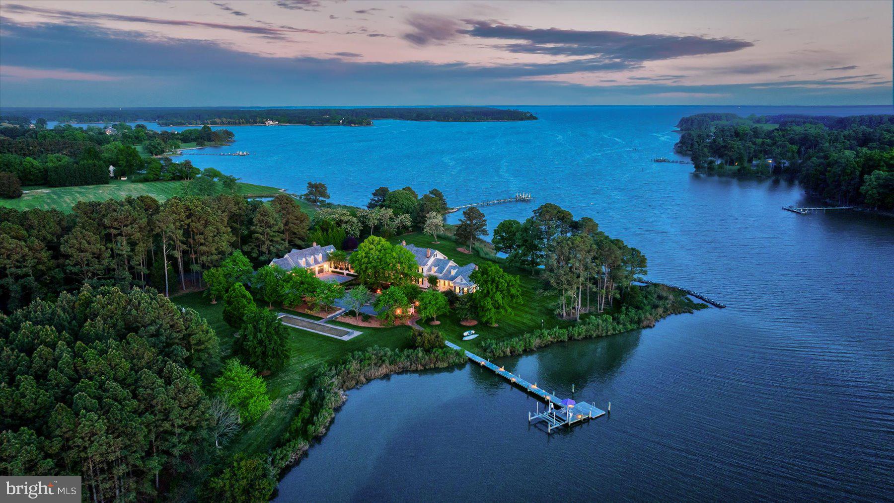 Absolutely stunning waterfront estate nestled between the charming locales of Easton and St. Michaels. Impeccably maintained colonial residence boasting approximately 1,000 feet of captivating waterfrontage. Enjoy the allure of a magnificent gunite pool complemented by an attached spa, a built-in fire pit, outdoor spa, and a serene pond. Welcomed by a grand, private entryway adorned with a sleek blacktop driveway.

Entertain with grace on the expansive porch featuring a vaulted ceiling, providing an ideal space for gatherings against the backdrop of a southwest exposure, offering breathtaking panoramic water views. Delight in outdoor activities on the bocce ball court while reveling in the seamless indoor/outdoor entertainment spaces.

Luxuriate in the refined interior adorned with fine finishes and fixtures, including crown moldings, shiplap, and wainscoting. Host unforgettable gatherings in the elegant formal dining room, epitomizing refined living at its finest. Retreat to the main-level primary suite for ultimate comfort and relaxation. Additional highlights include a charming pool house boasting a living room, full bath, and a second-floor office or flex space, as well as an apartment above the garage featuring a spacious living area, kitchen, bedroom, and bath.

The property is conveniently located 1.5 hours from D.C. and Baltimore, and 2 hours from Philadelphia.  Just minutes from fine dining, shopping, healthcare, theatres, galleries, museums, golf courses, a country club, a yacht club, and a jet airport.