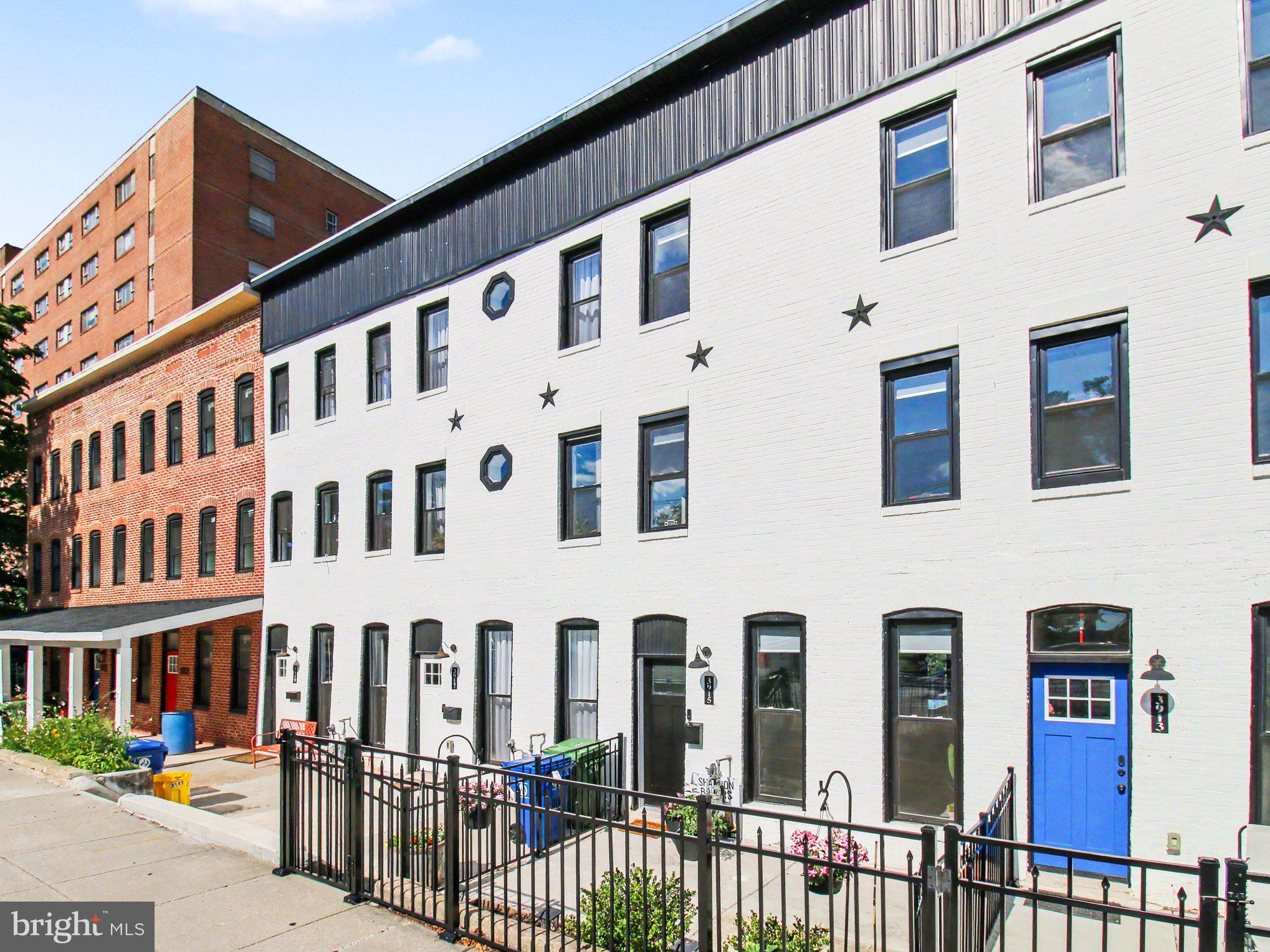 Open house Sat 6/27 from 12-2pm.  Welcome to this beautifully renovated 4-level townhouse offering the perfect blend of historic Baltimore charm and modern luxury in an unbeatable location! Just steps from The Rotunda Shopping Center, Johns Hopkins, neighborhood parks, community pools, restaurants, and everything Hampden and Roland Park have to offer, this move-in ready home is one you won't want to miss.

Completely renovated in 2022, this home features all the major upgrades already completed, including a new HVAC system, roof, windows, water heater, flooring, and a stunning open-concept interior designed for today's lifestyle. The bright and spacious main level offers soaring ceilings, an expansive living area, designer kitchen with island, quartz countertops, subway tile backsplash, stainless steel appliances, and abundant cabinet space—perfect for entertaining.

With four finished levels, the flexible floor plan provides generous bedroom sizes, updated bathrooms, dedicated home office space, and a versatile lower-level ideal for a guest suite, gym, or recreation room. The primary suite offers a peaceful retreat with ample space and stylish finishes throughout.

Outdoor living has been thoughtfully enhanced with custom landscaping and front terrace fencing completed in 2023, creating a private and inviting front patio. Enjoy your morning coffee or evening gatherings on the brand-new composite rear deck (2025). Additional updates include new exterior doors installed in 2026.

Parking is easy with the option of street parking and a private rear parking pad.

This exceptional home combines modern updates, flexible living space, and a walkable location close to shopping, dining, recreation, and commuter routes. This property may also be eligible for valuable Baltimore City tax credits, offering additional savings for qualified buyers - like CHAP.

Don't miss the opportunity to own a truly turnkey home in one of Baltimore City's most desirable neighborhoods!