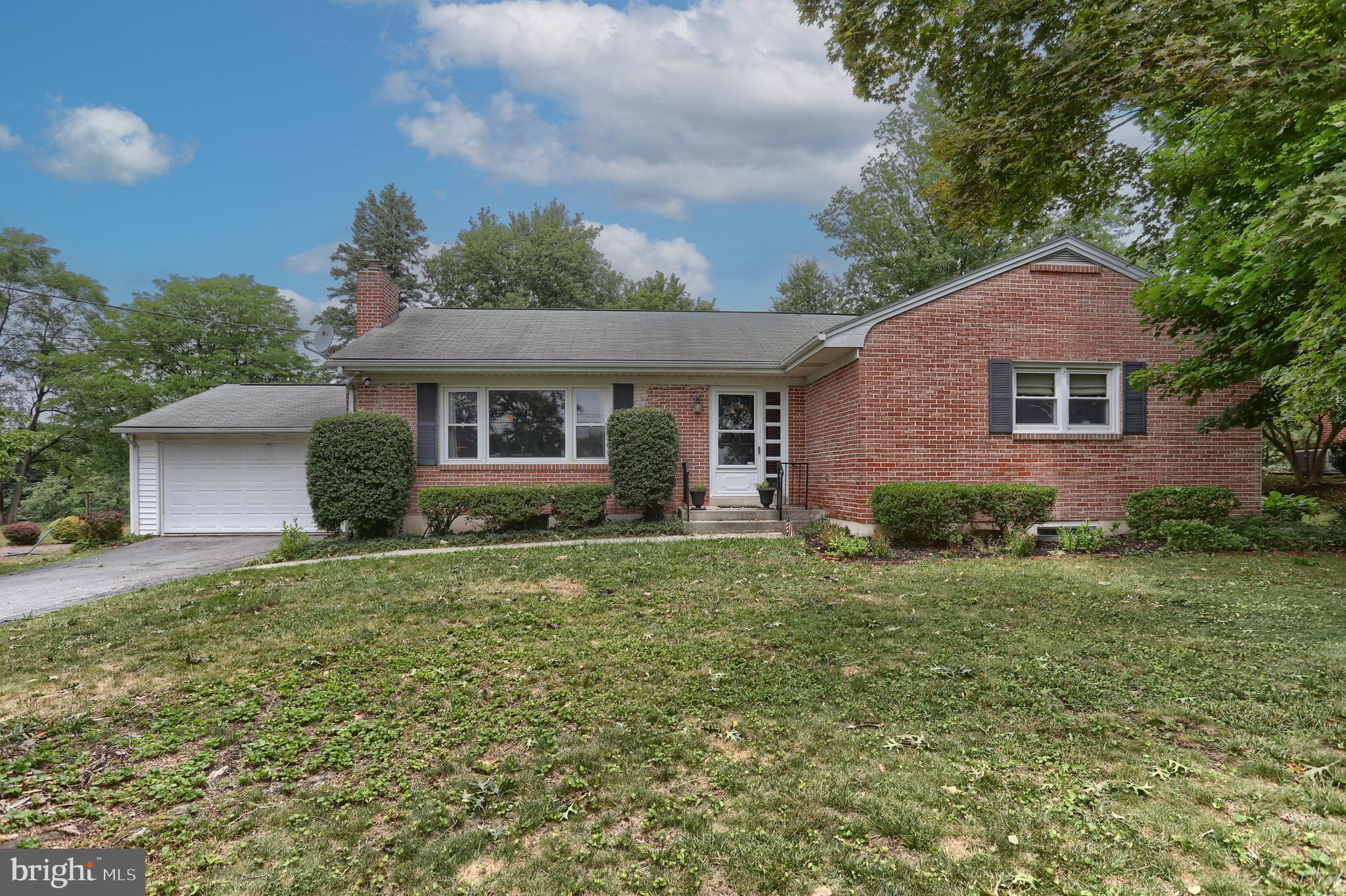 Welcome home to this spacious brick ranch, ideally situated on a beautiful lot in a quiet neighborhood just one mile outside of Hummelstown, offering the perfect blend of peaceful living and everyday convenience. Inside, you'll find beautiful hardwood floors throughout most of the main living area and an inviting, sun-splashed living room with a cozy wood burning fireplace.  The sweet kitchen features updated cabinetry, a nice dining area, and luxury vinyl plank flooring - all appliances included.  The finished lower level provides exceptional additional living space with a generous family room, versatile den or home office, cedar closet, and a full bath with a beautifully tiled walk-in shower.  Step outside to the glass-enclosed porch overlooking the private, fenced backyard—an ideal setting for relaxing or entertaining. Enjoy outdoor gatherings on the arbor-covered patio with an extended stone pavers area beyond with a fire pit - ideal on cool evenings.  For added peace of mind, a one-year First American Home Warranty is included.  Add this sweet home to your  must-see list; you won't want to miss it!!