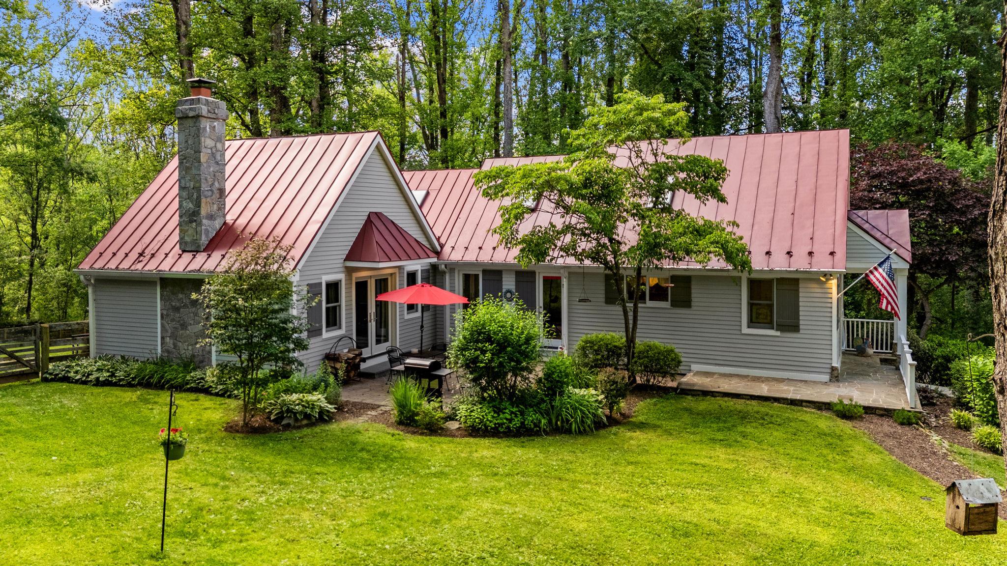 Amazing opportunity to own property along one of Loudoun's most scenic byways. Charming 3BR/2.5BA custom home with vaulted ceilings and exposed beams, hardwood flooring, two fireplaces and inviting outdoor spaces at every turn. Detached oversized two car garage with finished bonus room above offers flexibility of uses--an office, a gym, an extra space for guests or a fun recreation room. 
Adjoining 2.56 acre lot with idenitified drainfield location requires a boundary line adjustment to make it a buildable lot. This offers even more possibilities, build a second home, a compound or sell it!