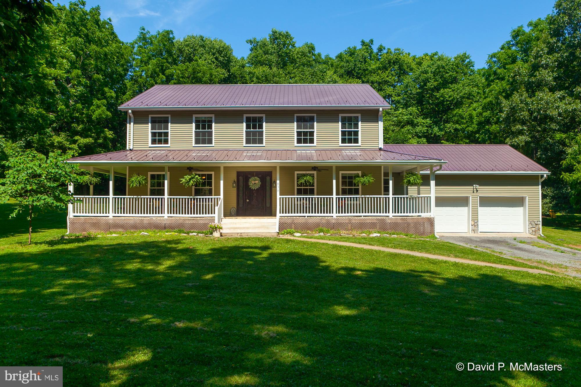PRICE ADJUSTMENT!  Nestled on 2.89 acres of open and wooded land in a river community, this charming two-story home offers four bedrooms and 2.5 baths, blending elegance and comfort. The welcoming wrap-around porch sets the stage for relaxation and outdoor enjoyment, while the attached 2-car garage provides ample storage and convenience. Inside, the home features wider-than-normal stair treads for added safety and accessibility, leading to a spacious second-level family room perfect for gatherings and 3 bedrooms. The main level boasts an open floor plan with a modern galley kitchen, seamlessly connecting to the dining and living areas. The primary bedroom, also on the main level, offers a private retreat with an ensuite that includes a separate shower, tub, and double sinks. This home perfectly balances indoor and outdoor living, which provides a children's play area, a fenced-in garden, and a shed along with access to community river amenities, ideal for those seeking a serene yet vibrant lifestyle.