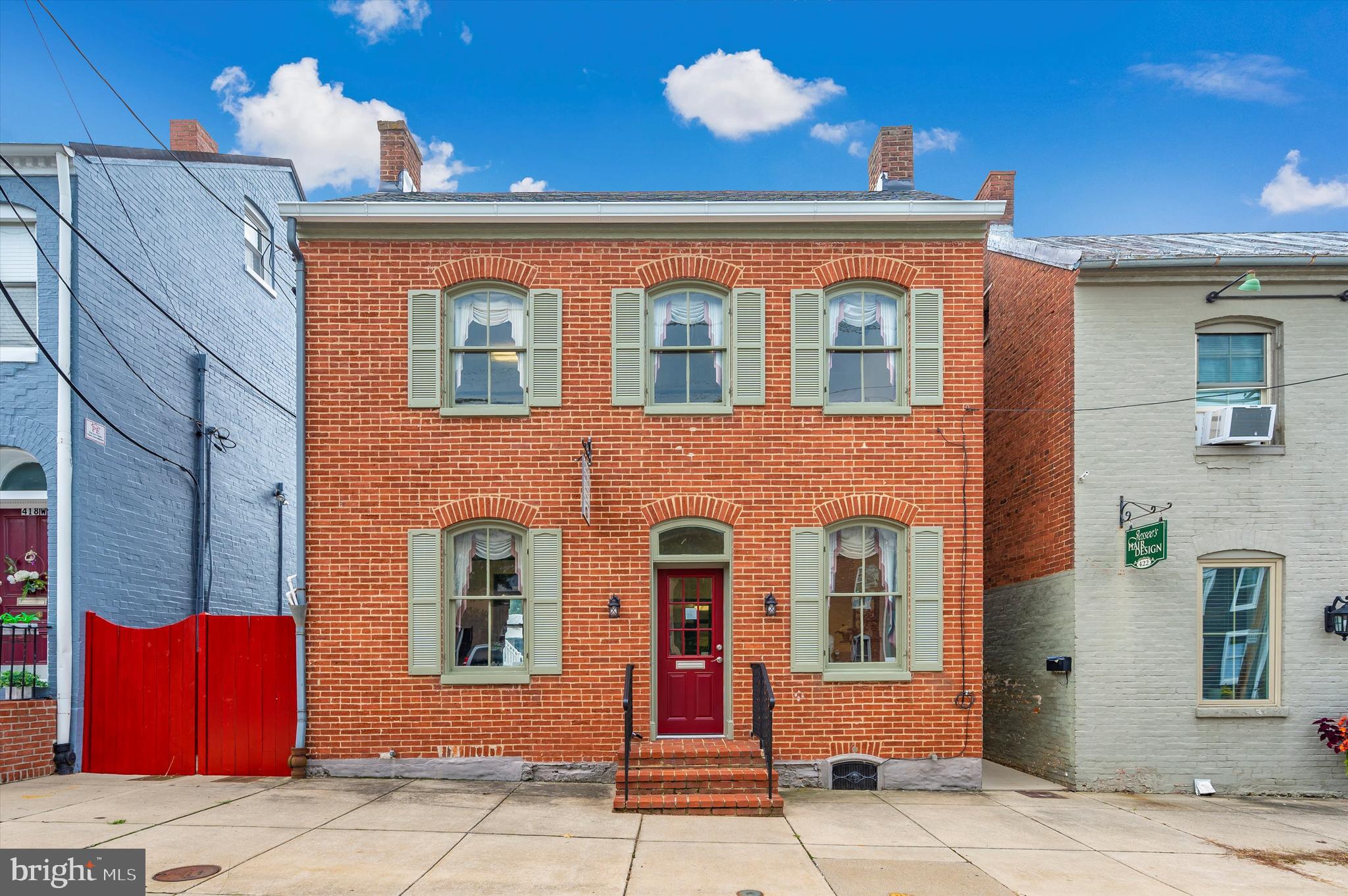 Discover a historic commercial gem on bustling West Patrick Street! This 1,394 SF property, zoned DB, is a charming all-brick building with 3 entrances, private parking for 6 vehicles, rear & side patios, and a balcony on the second floor. Inside, you'll find 5 spacious offices, a conference room, reception/waiting area, and 2 half baths, all meticulously maintained. Located near the Courthouse and downtown Frederick's amenities, including restaurants, specialty retail, and banking. Available for lease at $2,700 per month, plus utilities and common area maintenance, with a minimum 12-month term. Don't miss out on this opportunity in Historic Downtown Frederick!