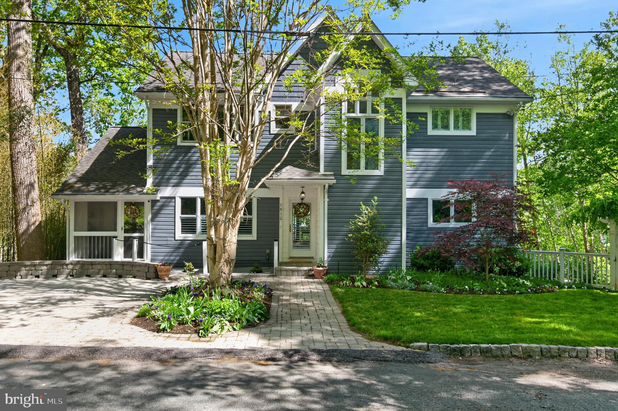 Enjoy unobstructed views of Saltworks Creek from this ideally situated home in the sought-after, water-privileged community of Severn Grove—just minutes from downtown Annapolis. Thoughtfully designed across three spacious levels, the home offers an open, light-filled floor plan that seamlessly blends everyday comfort with effortless entertaining, all defined by picturesque water views. The main level features warm wood flooring, a welcoming living room with a fireplace, and a well-appointed kitchen anchored by a large island and accented with plantation shutters. A main-level bedroom with a full bath and a separate office provide flexible living options. Step outside to multiple decks and a screened porch—perfect for relaxing or hosting while taking in the peaceful surroundings. Upstairs, three additional bedrooms include a water side primary suite with sweeping water views. A cozy library with custom bookcases and its own fireplace creates an ideal space for reading or working from home. Finishing out the second floor is a full bathroom and two bedrooms....one with water views. The fully finished lower-level lives like a private guest suite, complete with a bedroom, full bath, kitchen, spacious living area, and walk-out access—offering exceptional versatility for extended visits or multigenerational living. Additional features include off-street parking and access to Severn Grove’s exceptional amenities, including a clubhouse, beach, water access/marina, and kayak storage. With its flexible layout, scenic setting, and prime location, this home offers a rare opportunity to enjoy the best of waterfront living.