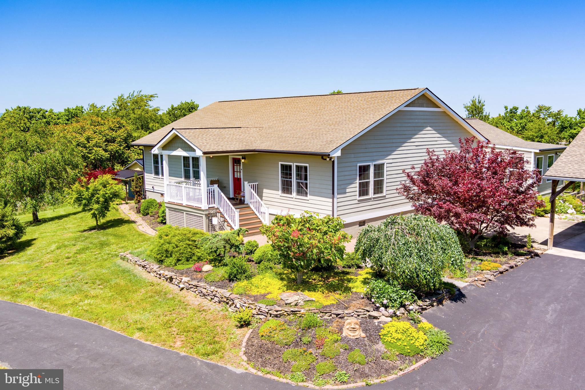 PRICE REDUCED !!!! Come check out this beautiful property!!!!! Nestled within the serene embrace of 11.415 sprawling acres, this meticulously crafted home with a total  living space of 3,645 square feet, stands as a testament to elegance and comfort. Surrounded by nature's tranquil beauty, this home offers an oasis of serenity, boasting panoramic views that stretch as far as the eye can see.

As you step through the grand entrance, you are greeted by an atmosphere of sophistication and warmth. The heart of this home is its custom-built 3/4 " cherry cabinets, crown molding, and custom-built book cases and entertainment center, a true masterpiece of craftsmanship that exudes timeless charm and provides ample storage space for all your  needs. This home offers a sunroom and mudroom and a large covered carport.

Flowing seamlessly beneath your feet are antique white oak floors, their rich hues adding depth and character to each room. Bathed in natural light streaming through expansive windows, the living spaces beckon you to relax and unwind in style.

Designed with both functionality and aesthetics in mind, every corner of this home showcases thoughtful details and impeccable design. From the spacious bedrooms offering peaceful retreats to the inviting living areas ideal for gatherings with loved ones, every aspect of this home has been carefully curated to elevate your living experience.

Step outside onto the vast expanse of land that surrounds the property, where lush greenery and breathtaking vistas create a picturesque backdrop for outdoor activities and moments of quiet contemplation.  With over 60 different trees planted on the acres the beauty abounds everywhere.
A 4,200 square foot Workshop/Woodshop/Garage awaits you complete with heat and air and 15 x 16 office space, laundry area and full bath. 

A new 2,400 square foot building built in 2020 with 200 amp service and heating and air, a full bath and is completely insulated would be perfect for a place to store your collections in. 

Raise some labradoodle puppies in your own Doodle House with spray foam insulation, complete with heat and air and water or convert it to an airbnb or in-law house.  So many options on this beautiful property!

Raise your own Wagyu beef or bring your horses. This property  also has  5 acres of invisible fencing.

Another plus is that this property is located 10 miles from Bryce Resort. 

With its unparalleled blend of luxury, comfort, and natural beauty, this custom-built home is more than just a place to live—it's a sanctuary where dreams take flight and memories are made to last a lifetime. Welcome home.