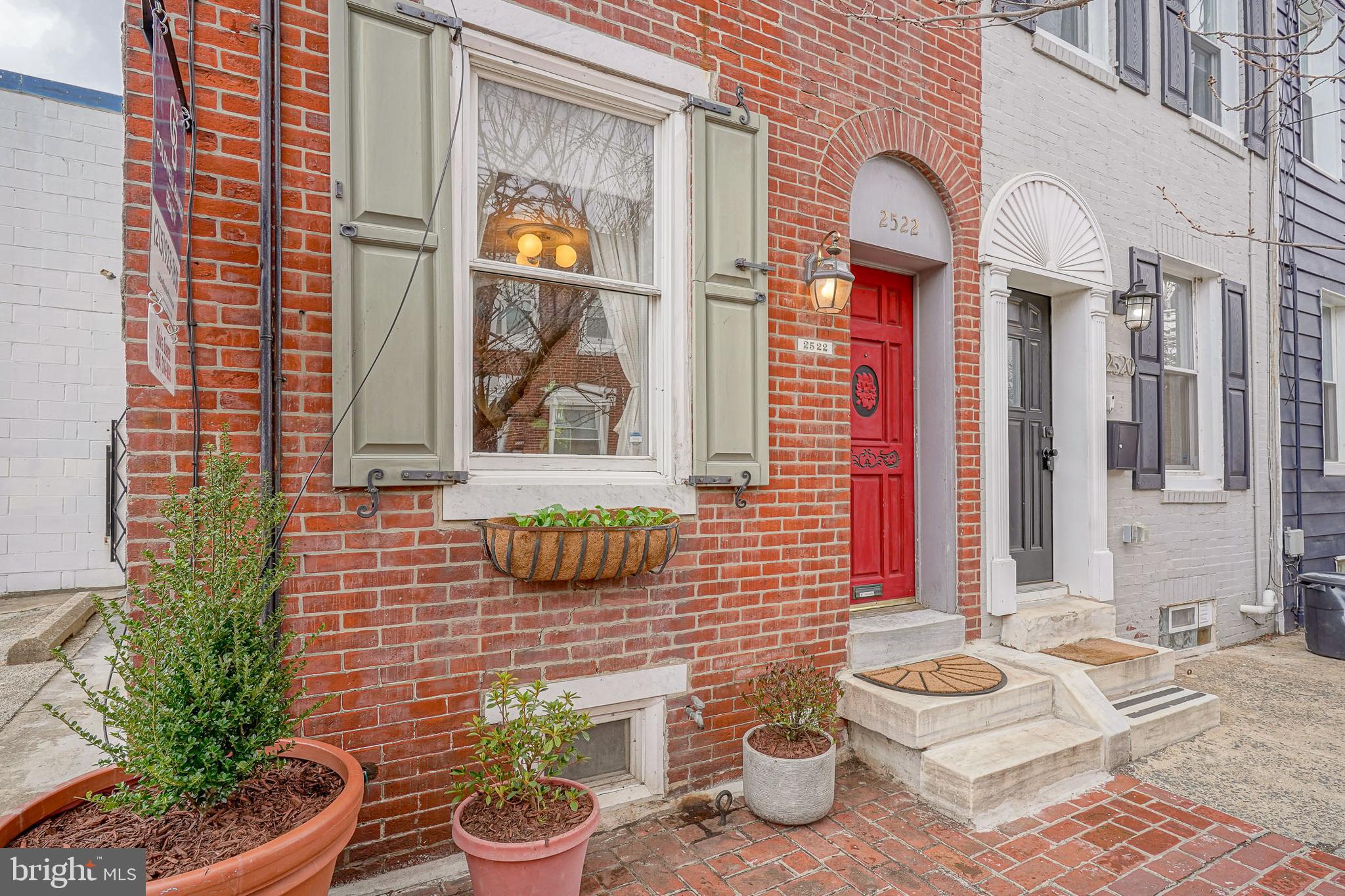 Welcome to 2522 E Boston Street. This inviting brick corner home stands out with its delightful green window shutters, bold red door, and bright potted plants. The bright, open floor plan features white-painted exposed brick and original wood floors creating a welcoming atmosphere perfect for entertaining. This first floor includes a full bathroom, dining room, living room, kitchen and a private covered patio in the rear. The kitchen has been beautifully renovated with sleek stainless steel appliances. Upstairs you'll find two spacious bedrooms. Both featuring ample natural sunlight and beautiful original hardwood floors. Off of the primary suite is a private deck perfect for relaxing. The basement features a full size washer and dryer with ample storage. Located just steps from the best restaurants and cafes that Fishtown has to offer. Schedule your tour today.
