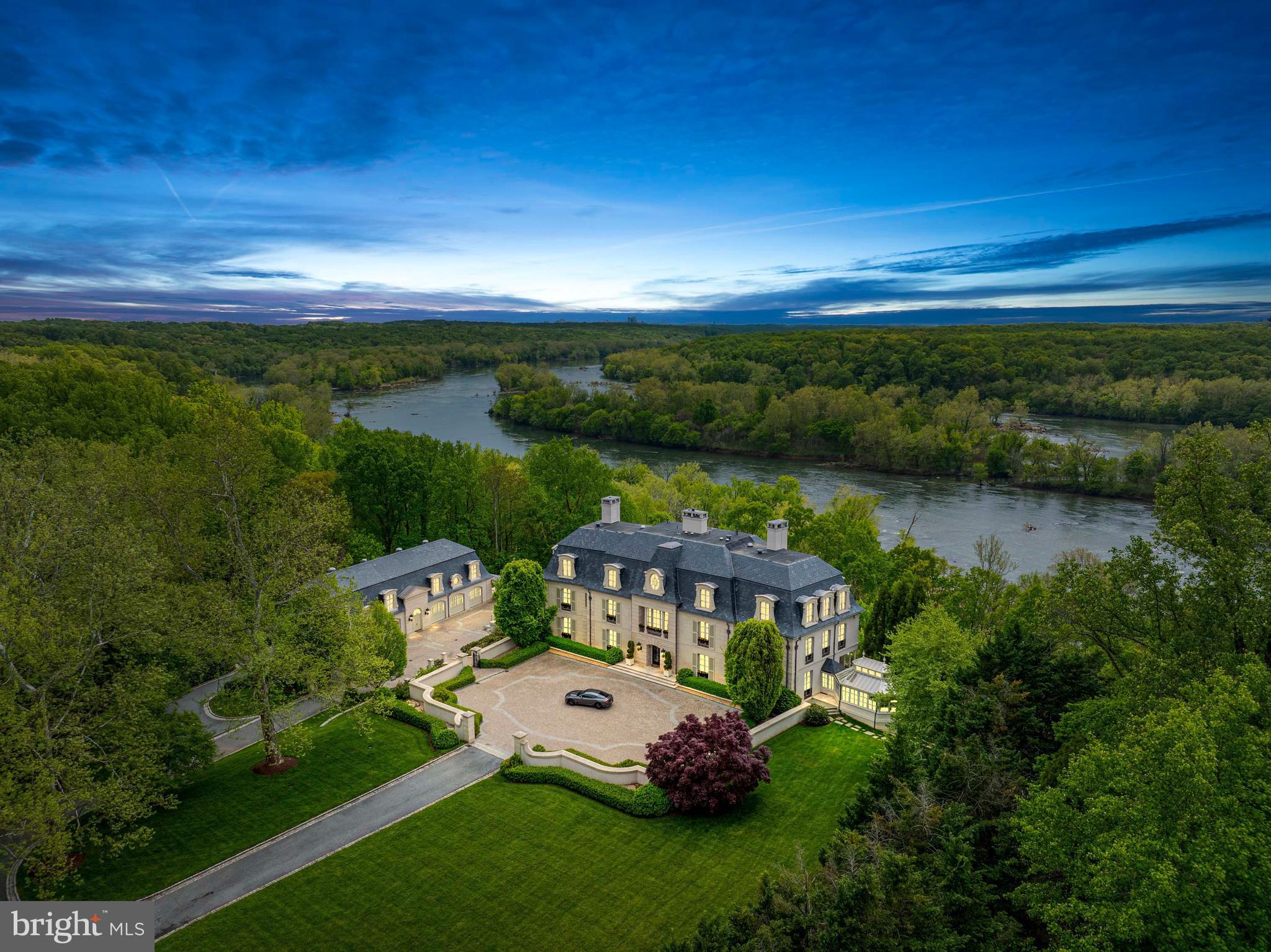 LUXURY PROPERTY AUCTION: 5–18 DECEMBER.

Accepting Starting Bids Through 4 December.

Starting Bids Expected Between $7.5M-$11.5M.


Earn an incentive by 4 December.

Anchored along the Potomac River on over 13 private acres, this magnificent French Chateau-inspired estate exemplifies the pinnacle of architectural refinement and luxurious living. Approached by a half-mile tree-lined drive beyond an arched gate, the residence unveils breathtaking panoramas of the river and protected parkland. A masterful collaboration between architect John Ike, designer Geoffrey Bradfield, and Horizon Builders, this limestone and slate masterpiece comprises over 40,000 square feet across three meticulously crafted structures. The 25,000-square-foot main residence features coffered ceilings, floor-to-ceiling windows, and imported stone detailing throughout four levels. The entertainment-grade lower level showcases a professional theater, clubroom with magnificent bar, and wine cellar rivaling the finest restaurants. A thoughtfully designed three-level guesthouse with 11 garage bays transforms effortlessly from automotive showroom to glamorous event space, while a 4,500-square-foot staff residence ensures seamless property management. Every amenity speaks to uncompromising luxury—commercial chef's kitchen, elevator access, heated pool, generator backup, automated snow-melt systems, and reverse osmosis water throughout. Remarkably, sale proceeds benefit The American Cancer Society, making this acquisition an extraordinary legacy opportunity.

Sale includes 11916 River Rd, Potomac, MD 20854