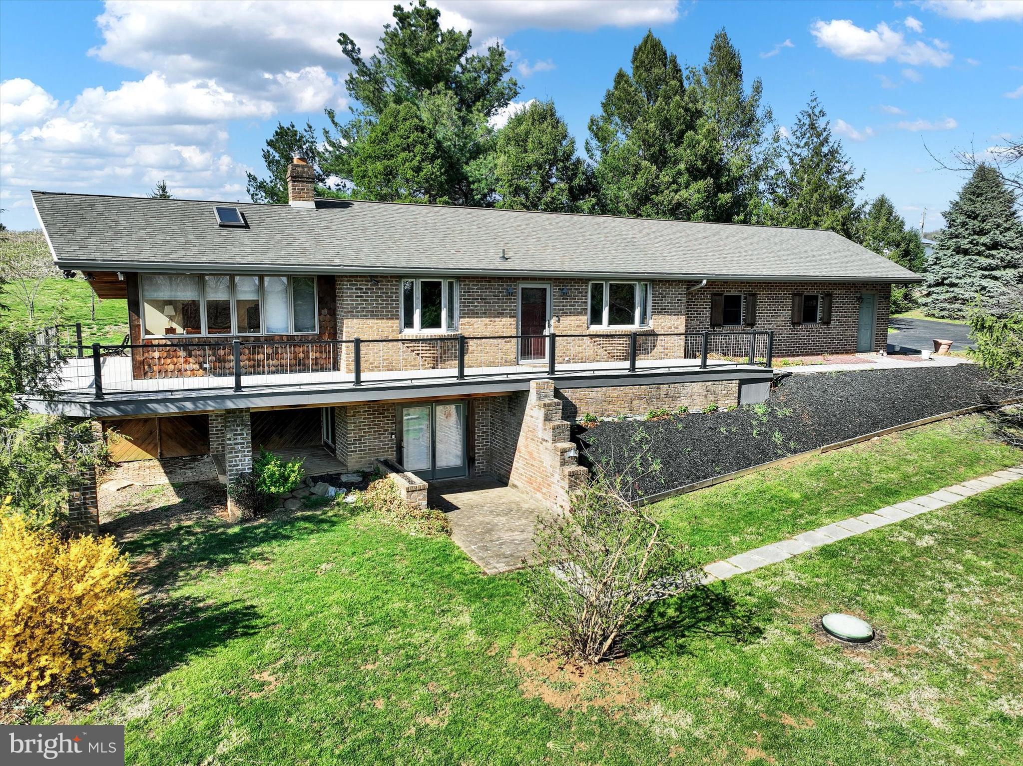 If you're searching for seclusion, and breathtaking views, look no further! This 33-acre property offers the perfect mix of fertile tillable ground and wooded acreage, with stunning views of the countryside and Codorus Lake. Inside, this updated home you'll find 2 bedrooms, 2.5 bathrooms, a renovated kitchen, and a luxurious primary suite with en-suite. The walkout basement adds flexibility, offering space for an office or additional bedroom. A backup generator and central home vacuum system ensure convenience and reliability. Step outside to a fenced garden and a separate fenced orchard with apple, peach, and nectarine trees, making this a dream for gardeners and homesteaders. The 40x60 pole barn with a 30x42 addition provides ample workspace and storage for equipment, vehicles, or hobbies. With wildlife, scenic beauty, and modern comforts, this property offers endless possibilities. Schedule your showing today!
