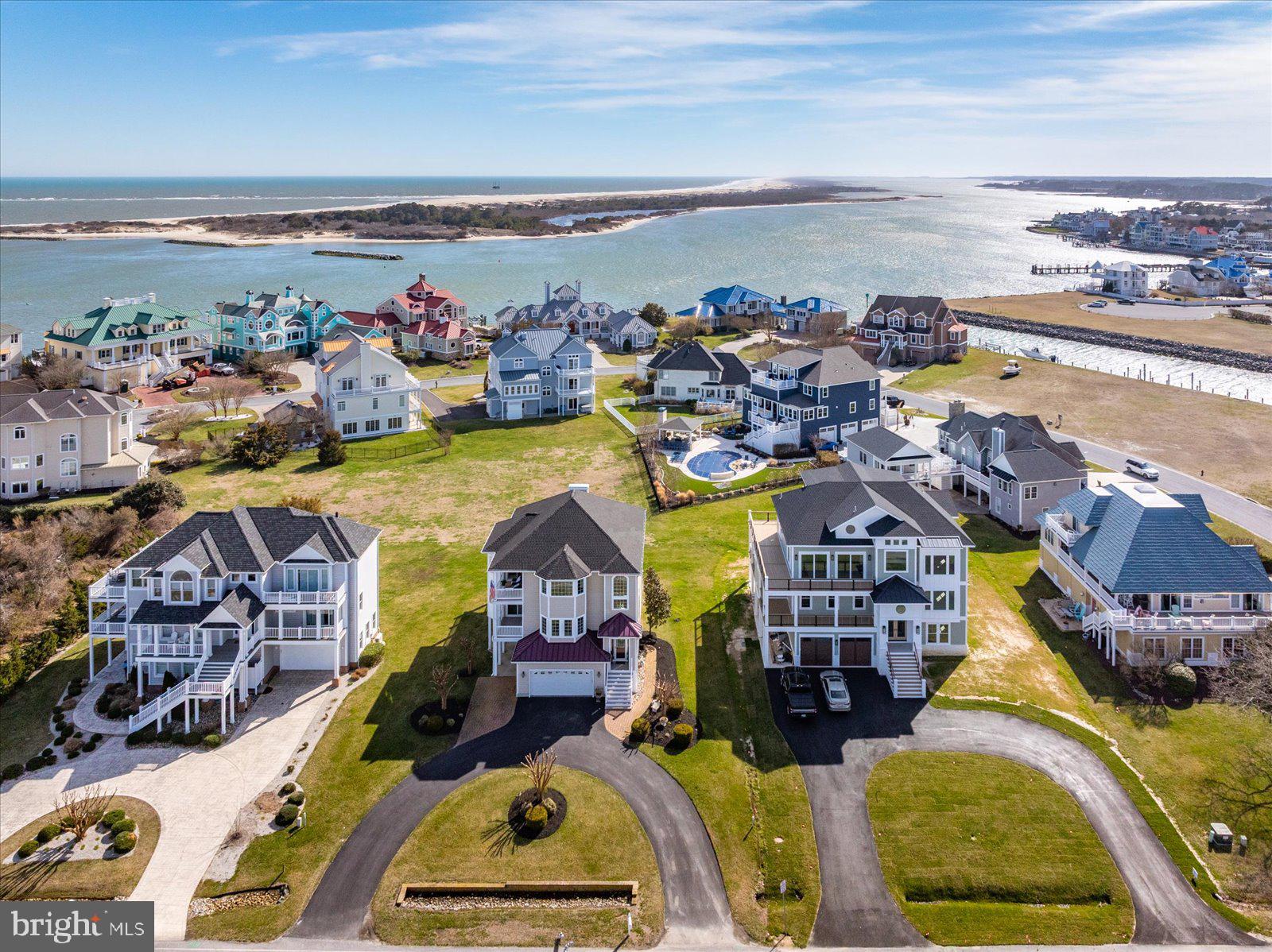 Experience coastal luxury in this stunning home located in the prestigious Martha’s Landing community! Thoughtfully maintained and designed for refined living, this home is ready to impress from the moment you arrive—featuring water views from nearly every room.

The ground level provides incredible flexibility, featuring a private bedroom, living area, full bath, kitchenette (with room to expand into a full kitchen), and washer/dryer hookup—perfect for guests or a separate living space.

Take the elevator to the main level, where you’ll find a welcoming foyer, two spacious guest bedrooms, a full bath, and a versatile office or craft room that could easily serve as a fifth bedroom. The oversized primary suite is a true retreat, complete with a walk-in closet, luxurious en-suite bath, and a convenient wet bar—ideal for enjoying your morning coffee before stepping out onto your private balcony, all while taking in serene water views.

The top floor is designed for unforgettable entertaining, showcasing an open-concept layout with a gorgeous kitchen, breakfast nook, dining area, sitting room, living room, and bar—all enhanced by sweeping water views. Step outside to your balcony and enjoy breathtaking sunsets, watch the OC Air Show, fireworks, and take in the beauty of the surrounding water.

This exceptional home perfectly blends elegance, comfort, and coastal charm—luxury living at its finest.