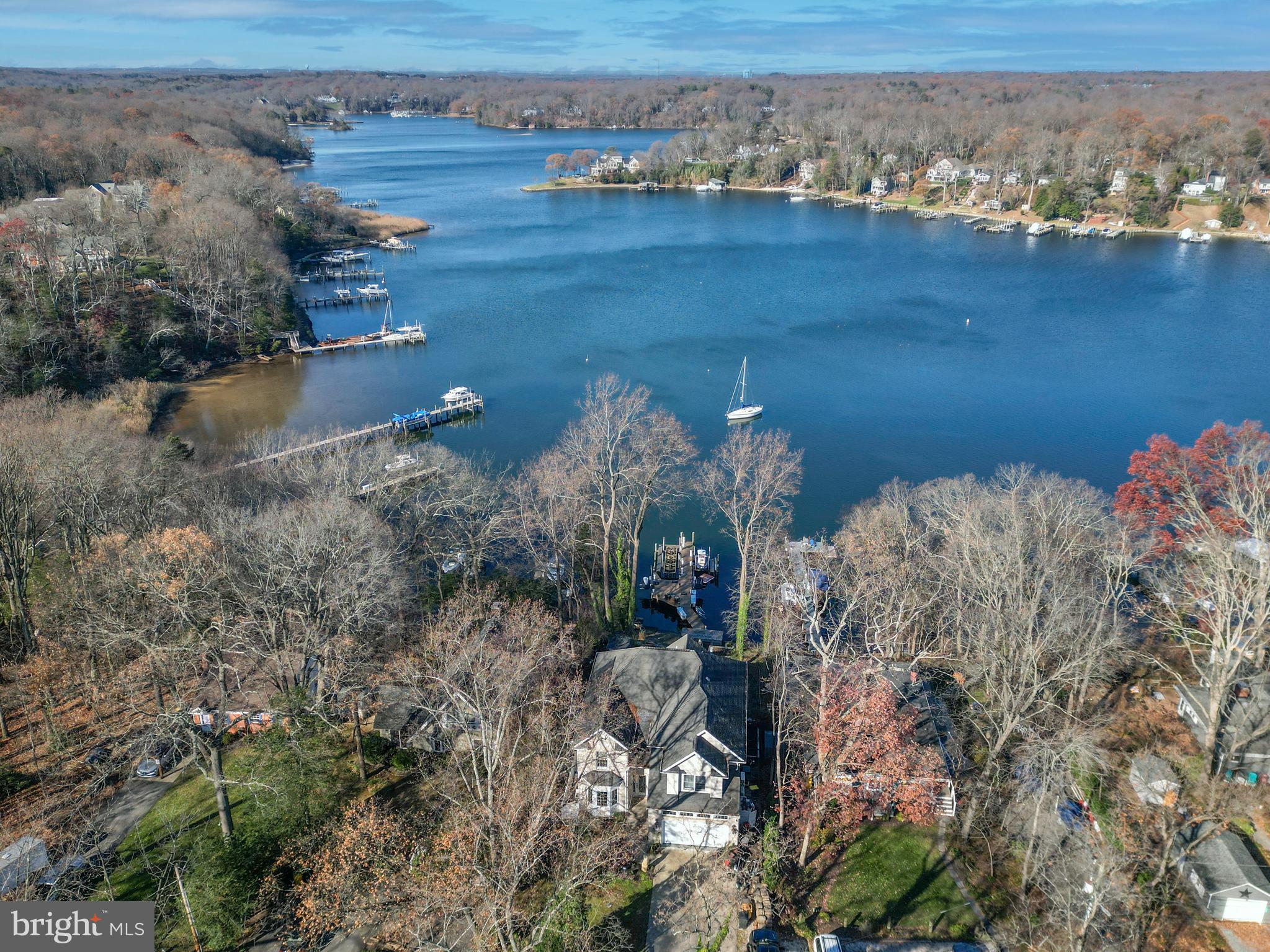 New Severn Run High School. Now is your chance to own this stunning Crownsville waterfront oasis just in time for spring! Discover the ultimate waterfront lifestyle with 60 feet of prime Severn River frontage, offering awe-inspiring views and endless opportunities for relaxation and entertainment.

This elegant home combines personal retreat and entertaining luxury, featuring a main-level office ideal for working from home or managing personal affairs in a peaceful and productive setting. Designed for comfort and sophistication, this approx. 3,799 total sq' home boasts hardwood floors throughout and a new wood floating stairwell with sleek cable railings.

The chef’s kitchen is a culinary haven with a gas stove, convection oven, granite countertops, stainless appliances, and a Samsung Family Hub smart refrigerator. Nearby, the cozy gas fireplace and convenient main-level laundry room add ease to everyday living.

The private owner’s en-suite is a sanctuary, offering stunning Severn River views. This expansive bedroom features a double-sided stone gas fireplace, an oversized walk-in closet, crown molding with lighting, leveler blinds, en-suite bathroom with a double vanity, smart mirror, Jacuzzi tub, and a luxurious stone-tiled walk-in shower complete with double rain showerheads, smart mirror, heat light, and built-in music.

Step outside to your personal private retreat. Enjoy the heated floating pool with a waterfall and entertain with ease in the outdoor kitchen, equipped with a Paradise propane grill, refrigerators, a wine cooler, sink, and Bluetooth-enabled speakers. Gather around the stone masonry fireplace, framed by 3.5 tons of pristine white sand, for unforgettable evenings under the stars. The floating stepping stone patio with integrated lighting adds a touch of evening ambiance, while the Tiki hut and bar—complete with a refrigerator, wine cooler, and ice maker—offer a fun and functional space for relaxation.

For water enthusiasts, the private dock includes 2 boat lifts, 2 jetski lifts, and a seating area, making it easy to fully embrace the Severn River lifestyle.

Upstairs, additional amenities include a sauna and tanning bed for the ultimate in relaxation, transforming this property into a luxurious retreat.

This home is not just a residence—it’s a sophisticated haven where everyday life feels like a vacation. Schedule your private tour today and experience the magic of Severn River living!

Community Amenities:

Living in Arden on the Severn means enjoying access to five private beaches, three boat ramps, fishing piers, a dinghy dock, and kayak storage space for rent. The Arden Community Association hosts a variety of activities, including kids and teen clubs, monthly senior lunches, and annual events such as summer beach festivities, Tent-or-Treat at Halloween, and a festive Christmas parade. This lively neighborhood ensures there is always something fun to participate in, fostering a strong sense of community and belonging. Experience the idyllic lifestyle and vibrancy of Arden on the Severn.