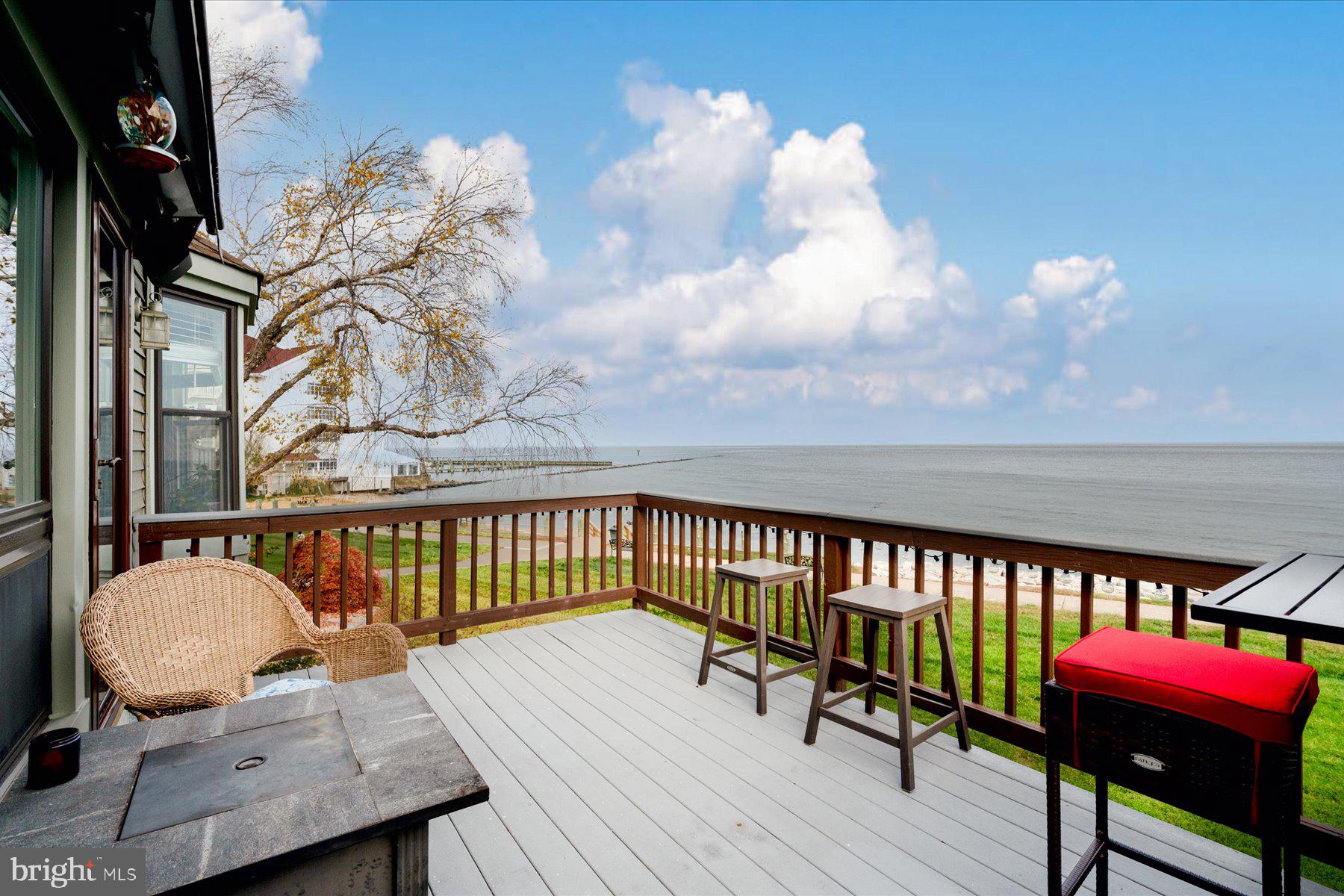 Panoramic views of the Chesapeake Bay.  This water view home sits right off the water with beach front access!  A beautiful residence in the heart of Chesapeake Beach.  Currently close to Rod and Reel Casino and Resort, shopping centers, water park and restaurants.  Offering three bedrooms, two full bathrooms (jacuzzi tub in second bathroom), upgraded kitchen, dining room, family room, two fireplaces, back deck, enclosed sun room with a hot tub and a attached one car garage.  Additional upgrades include new paint and gleaming new floors.  Town rental permit to convey