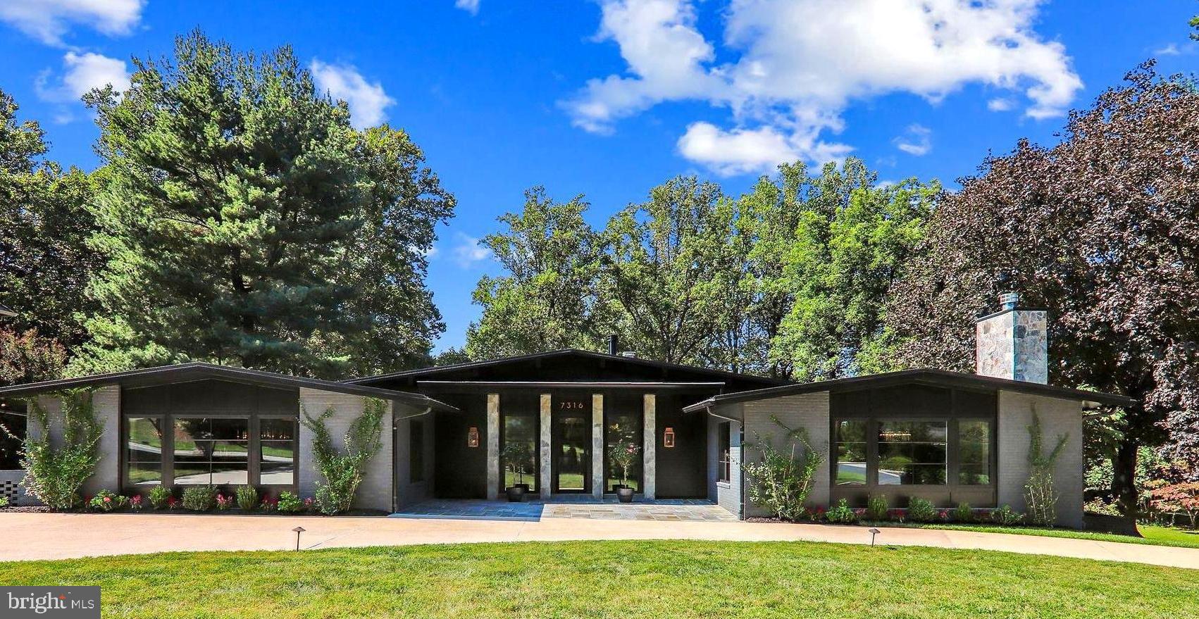 Redesigned flow, complete renovation, and exceptional in every detail, this elegant, professionally designed home, located in Bannockburn Estates, is unique in style and design through thoughtful visual connection to the surrounding exterior spaces .  This sale includes two lots totalling 1.25+ acres backing to beautiful Booze Creek Stream Valley Park, a conservation area.

The modern unique exterior appears demure.   This exciting and well appointed home boast FOUR main level bedroom suites with almost 6,000 sq. ft. main level living area and over 3,000 sq. ft. lower walk-out level which also has another bedroom suite.  Welcomed by dramatic lighting and marble floored foyer, the spaces are expansive while maintaining an intimate feel with exceptional design, attention to detail and exceptional quality.  There is a formal living room with vaulted ceiling, oak beams, a gas fireplace, a formal dining room with coffered oak ceiling that  is stunning.  Adjacent is a butler’s pantry, large walk-in pantry, and mudroom with a side entry.  The kitchen is gorgeous with high end appliances, extra refrigerator drawers, two dishwashers, double-oven, unique built-ins, large island with additional sink, table spaced eat-in area and open to the soaring oak-beamed ceiling in the family room with gas fireplace, deck, and a large screened in porch featuring a wood-burning fireplace.  The floors on the main level are primarily European French oak engineered hardwood and special touches throughout include built-ins, special lighting, and thoughtful grand hallway leading to the four main-level bedroom suites. 

The primary owner's suite is a dream come true with the very personal connection to the outdoor spaces and exceptional design and light coming from three sides.  It includes a large deck off the primary suite overlooking the property.  There are dual walk-in dressing rooms/closets with custom built-ins.  The master bath is exceptional in every detail, dressing table, dual vanities, soaking tub with amazing views, large steam shower, privacy closet, and four-person sauna.   The three additional main-level suites, each with private uniquely designed full bathrooms and walk-in closets.  The grand hallway has a well-organized laundry room with plenty of storage in a central location.

The renovation, redesign, and expansion were completed in 2023.  In addition, an accessory unit was constructed with two level deck, wood burning fireplace, artist studio (including special sink trap), office, closet, half-bath, separate HVAC, tankless HWH, and spiral staircase. The house together with the accessory unit is almost 10,000 square feet.

The lower level is great for entertaining with a built-in wine tasting room, media room, large recreation room with a built-in bar, beverage cooler, and refrigerator, a gas fireplace, powder room, a bonus room that would be a great gym/office/hobby room with an outside entrance.   Additionally, this level has another bedroom suite with full bath and walk-in closet with separate outside access.  This well planned home keeps the household organized with smartly located storage, extra closets, and two separate mud rooms (one on each level).  There is an expansive three car garage on this level with a mudroom to organize the homes inhabitants.  There is ample parking on the property. 

The pool, hot-tub, and spacious outside living areas have direct outside access to a half-bathroom, shower room, and an additional dressing room for convenience.  There is also a separate pool equipment room integrated into the house.  There is a shed with electricity, dog run, and a rustic firepit area on the property.     By appointment only.  

This sale includes the additional lot .  All information is deemed reliable, but not guaranteed. See the interactive floorplan.  This is truly a special home completely redesigned and reimagined.