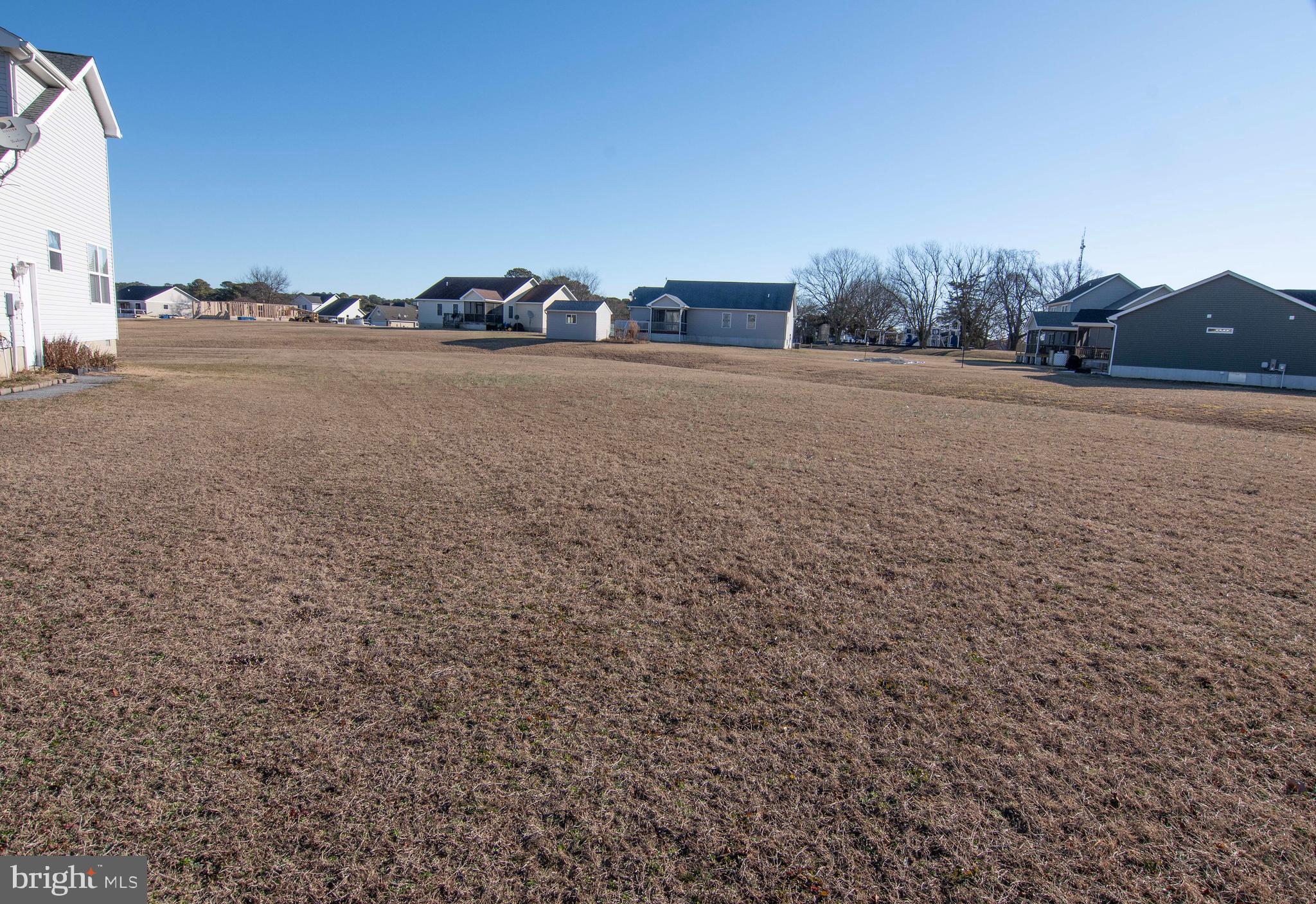 This beautiful Golf Course lot is ready to be the location of your new home! This site is over a quarter of an acre and is already cleared. Purchase now and build later. Make your dream a reality & start enjoying all that Captain's Cove has to offer. Features include indoor & outdoor pools, a restaurant, banquette rooms, fitness center, basketball & tennis courts, boat launch, playground, security and so much more! All included in the HOA!